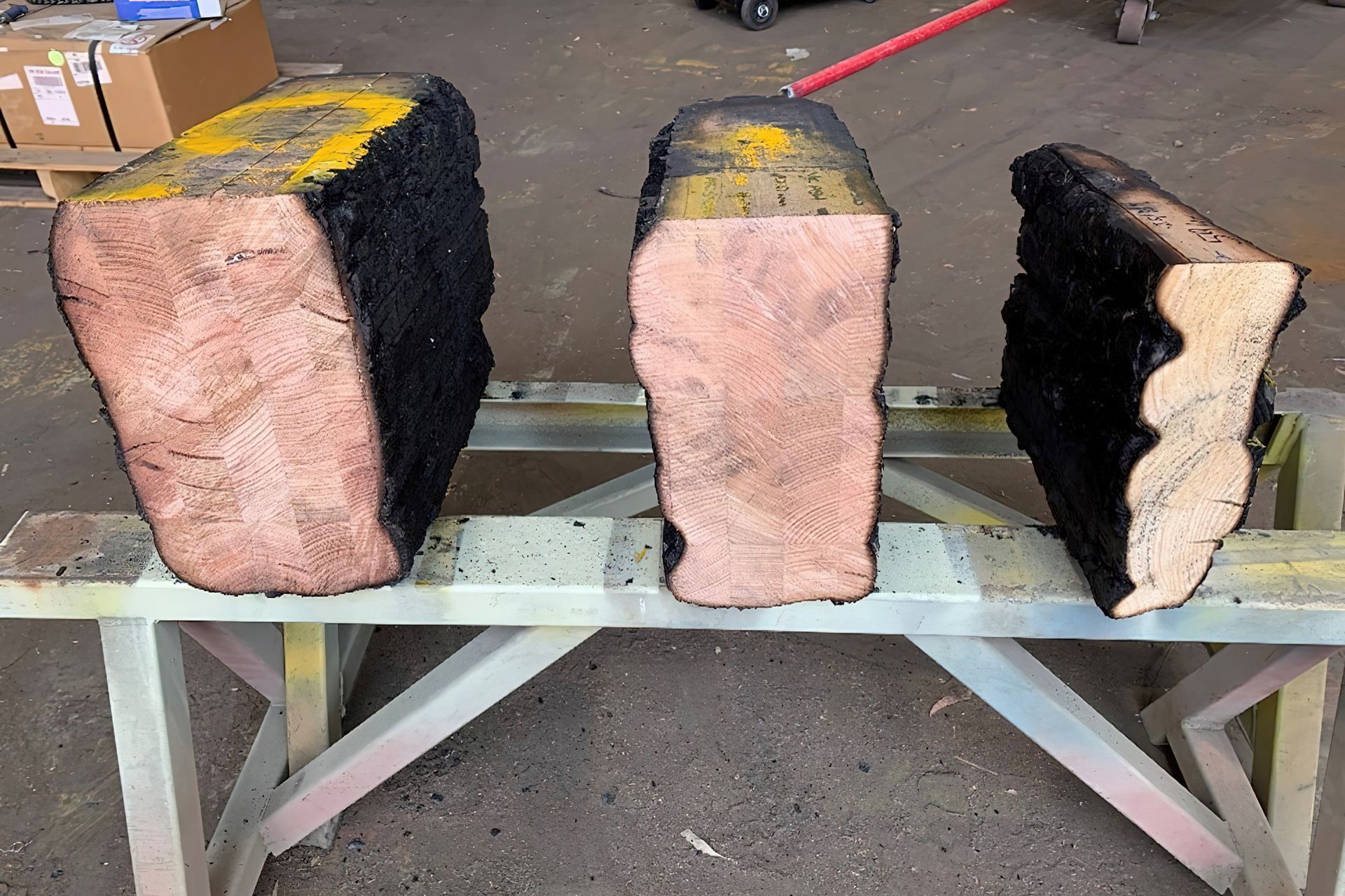 Figure 1: Grey Gum (Left), Tasmanian Oak/Victorian Ash (Middle) & Radiata Pine (Right) MASSLAM components after undergoing a 120-minute ‘loaded’ beam fire test.