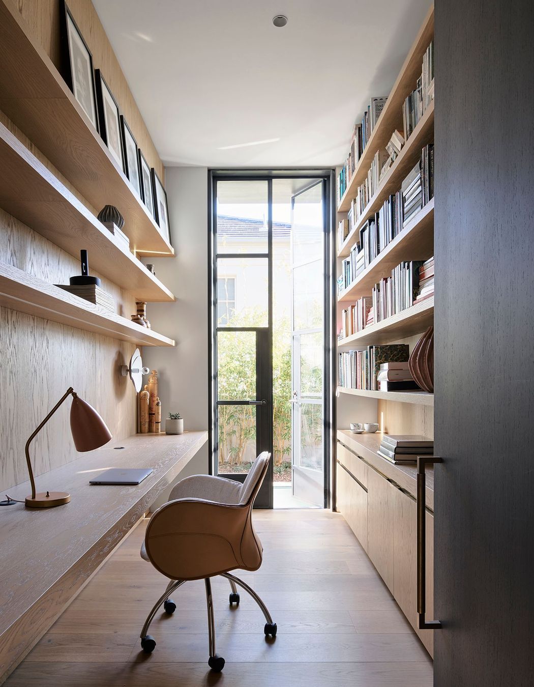 The entrance to the private office features the Mid Antique Brass Waxed finish.