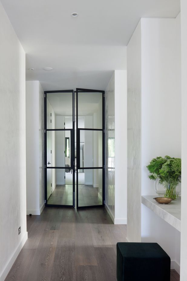 The subtle texture on these walls adds depth to an otherwise white palette.