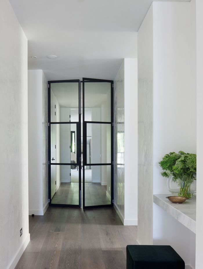 The subtle texture on these walls adds depth to an otherwise white palette.