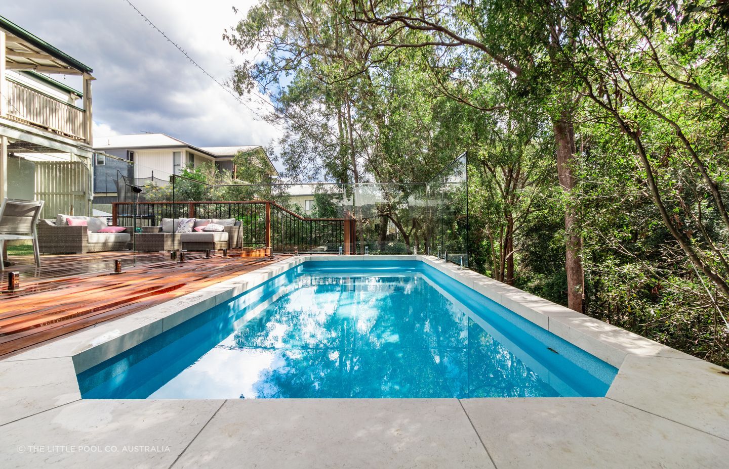 Tricky sites such as this are suited to creating a pool area that seamlessly flows onto an outdoor deck.