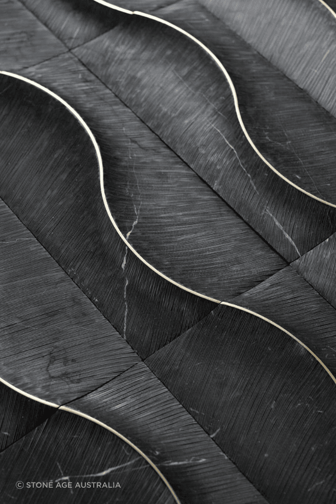 The cladding features hand carved Nero Marquina marble from Spain with brass inlaid by the master artisans.