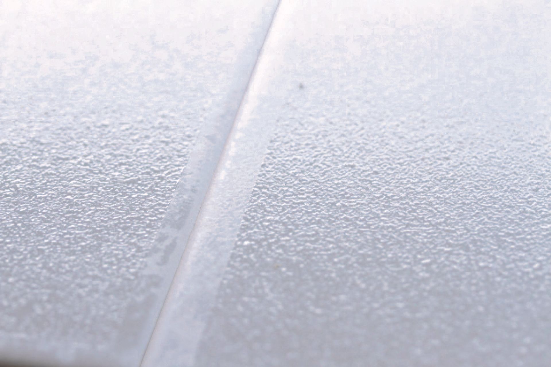 A close-up of Swiss Grip shows its textured surface.