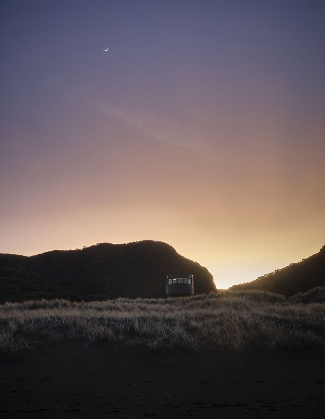 Te Pae at sunrise, peeking gently over the sand dunes.