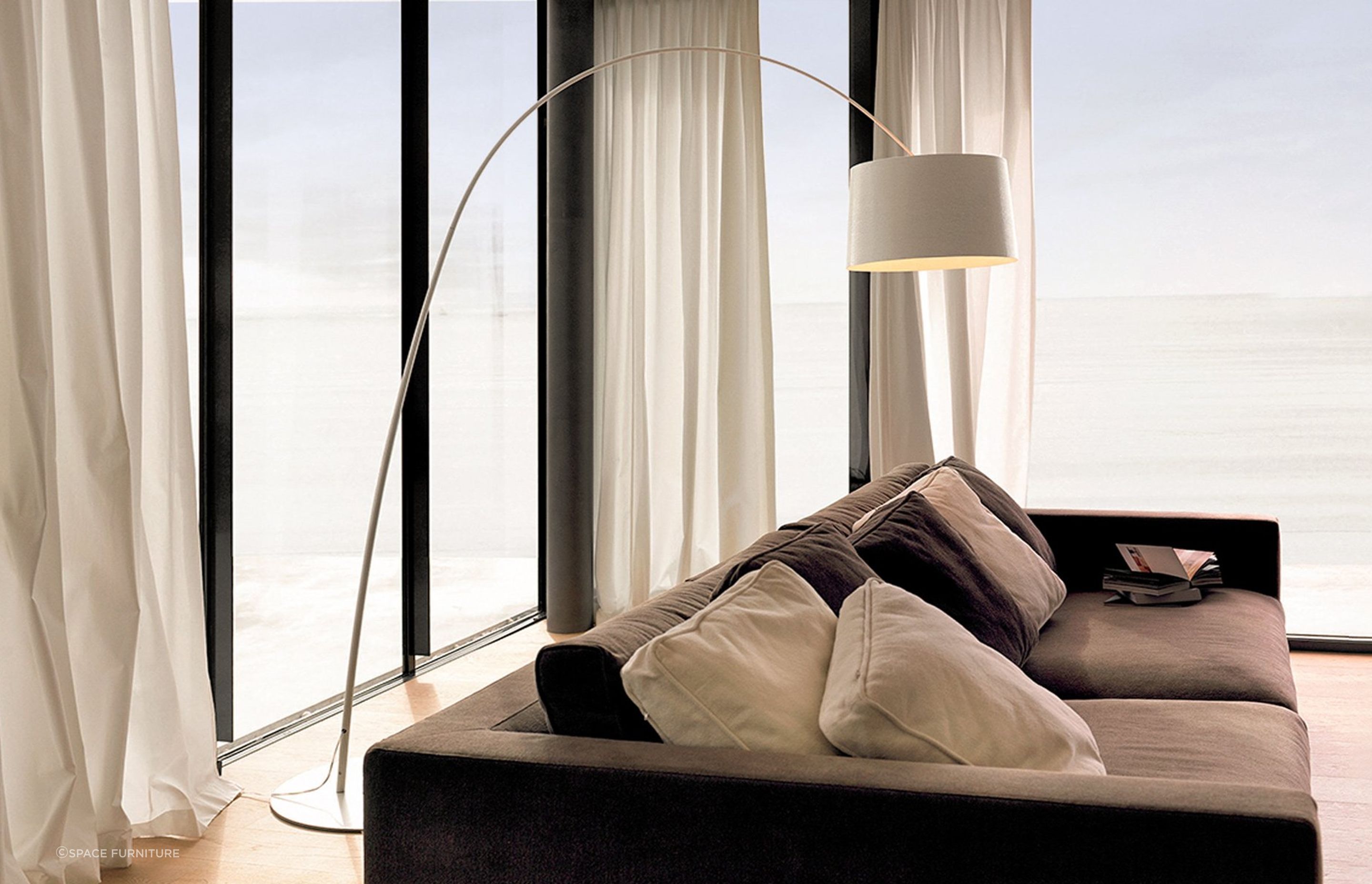 The flexible extension rod of the Twiggy Curved Floor Lamp allows for plenty of flexibility in terms of lamp placement.