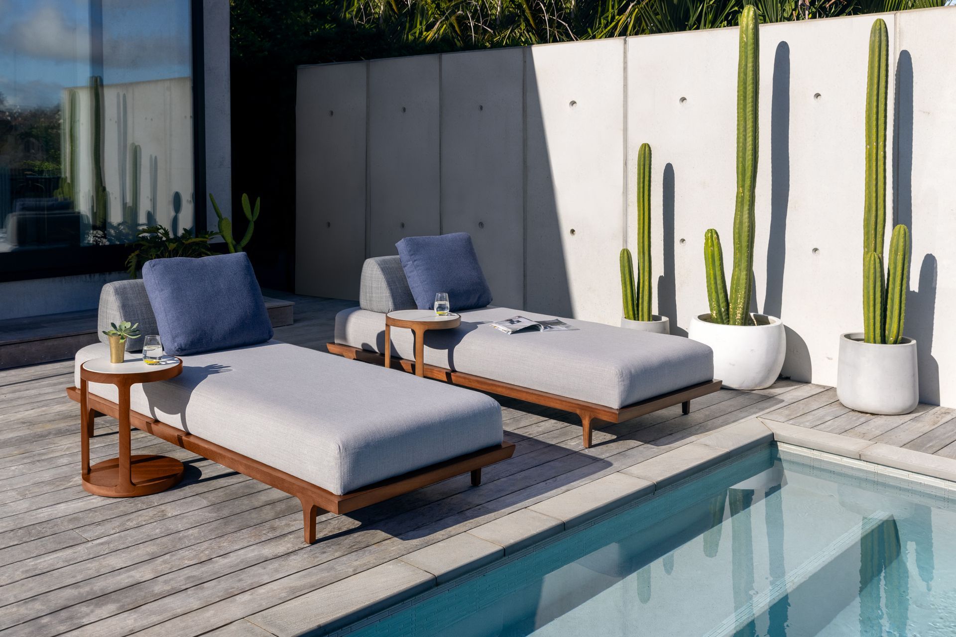 The Porto lounger is a fusion of style and practicality. Featuring an elegantly crafted FSC-certified iroko wood frame, the refined geometric lines combined with its organic form create an inviting and striking piece of furniture.