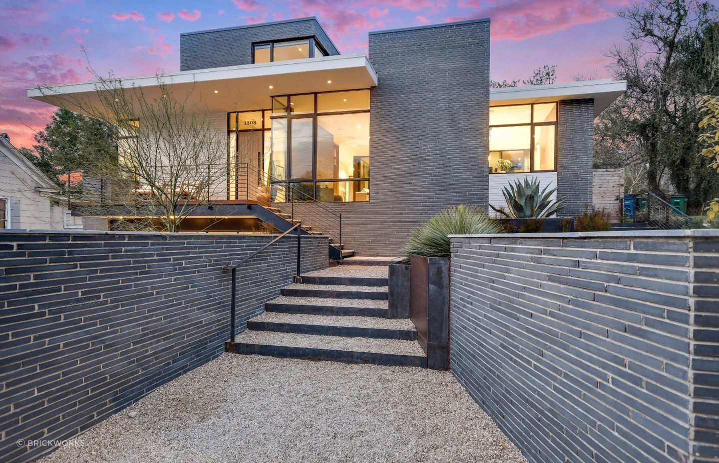 Dramatic proportions inherent in long-format bricks accentuate the linear feel of this walled entrance.