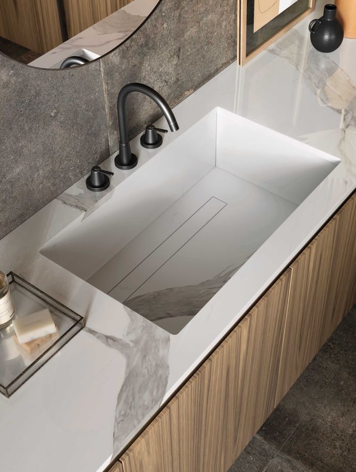 Porcelain slabs perform well in a bathroom environment and can be used for vanity tops, washbasins and shower trays.
