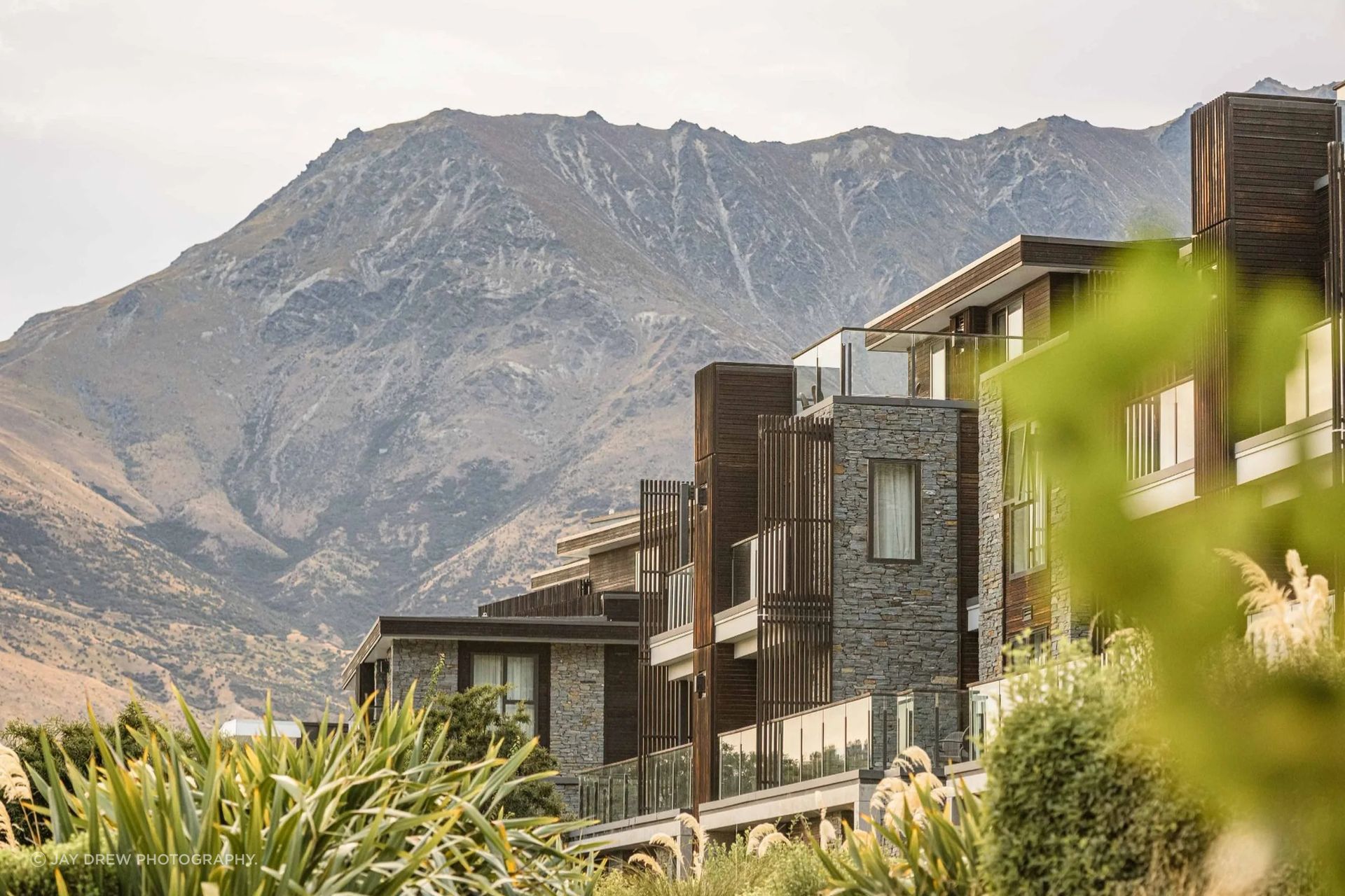 Hilton Hotel, Queenstown, features Gibbston schist cladding by The Natural Stone Co., used across exterior walls and feature pillars to ground the architecture in its alpine setting.