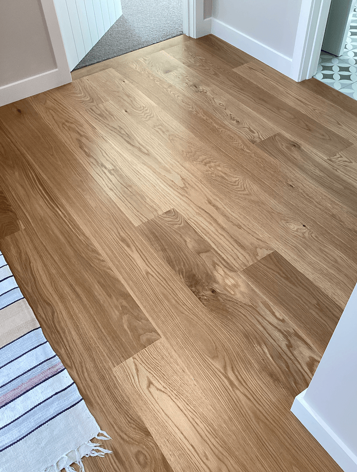 American white oak coated with polyurethane.