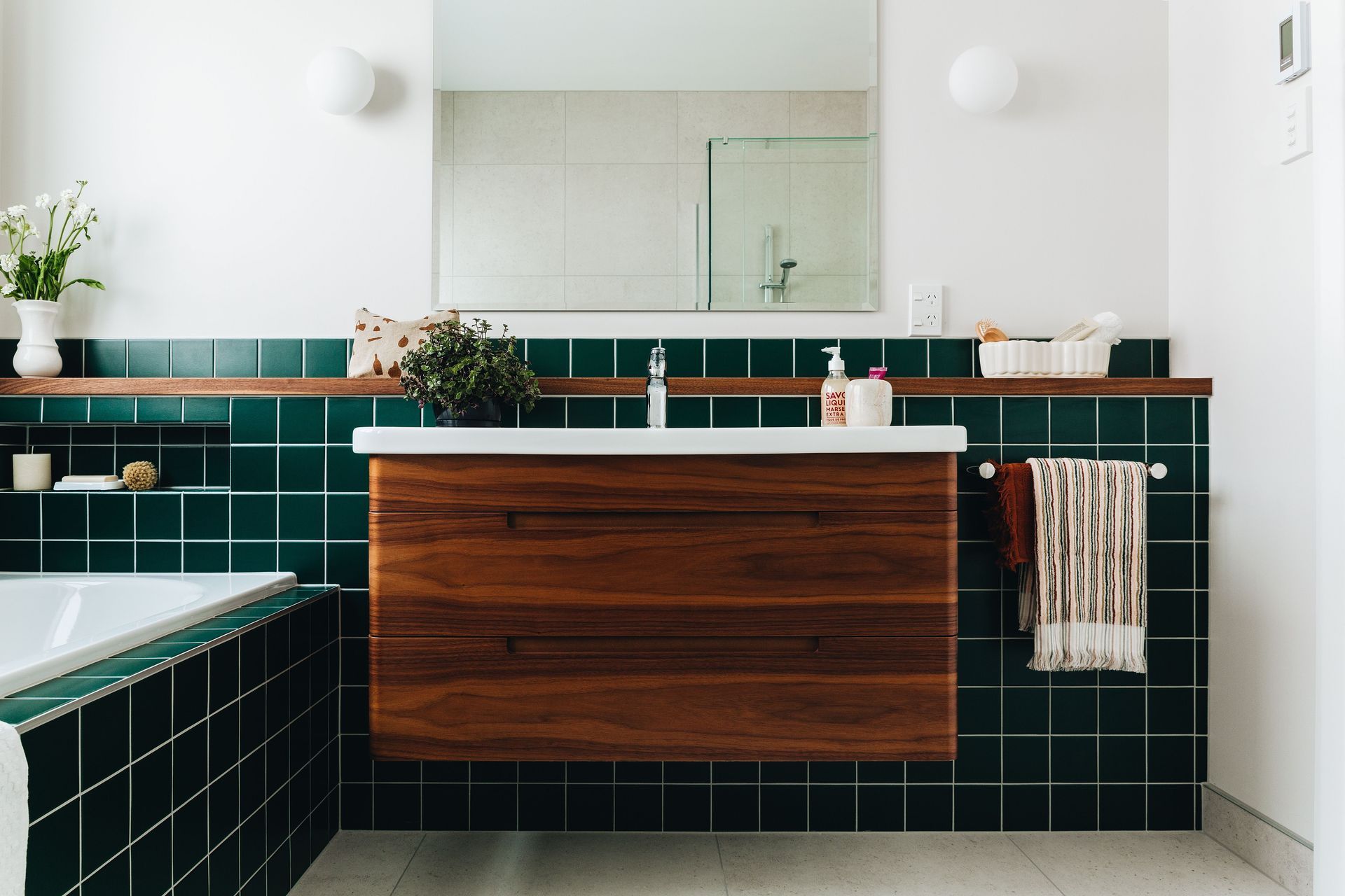 Eastbourne Green Bathroom - Our client was not afraid to embrace colour which meant we could use the striking green tiles.