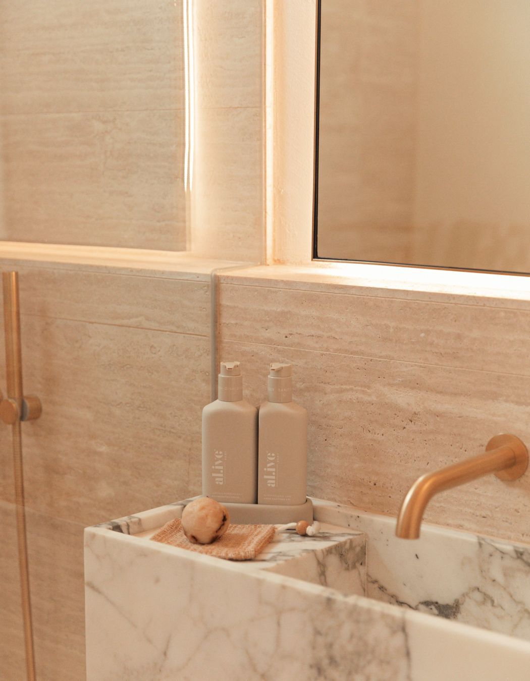 In the bathroom, a bespoke stone basin is the ultimate in luxury.