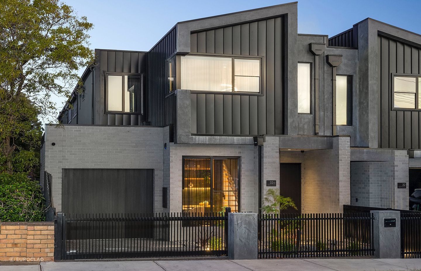Singe lock cladding provides this townhouse with a clean, sleek finish. Featured product: Standing Seam Cladding.