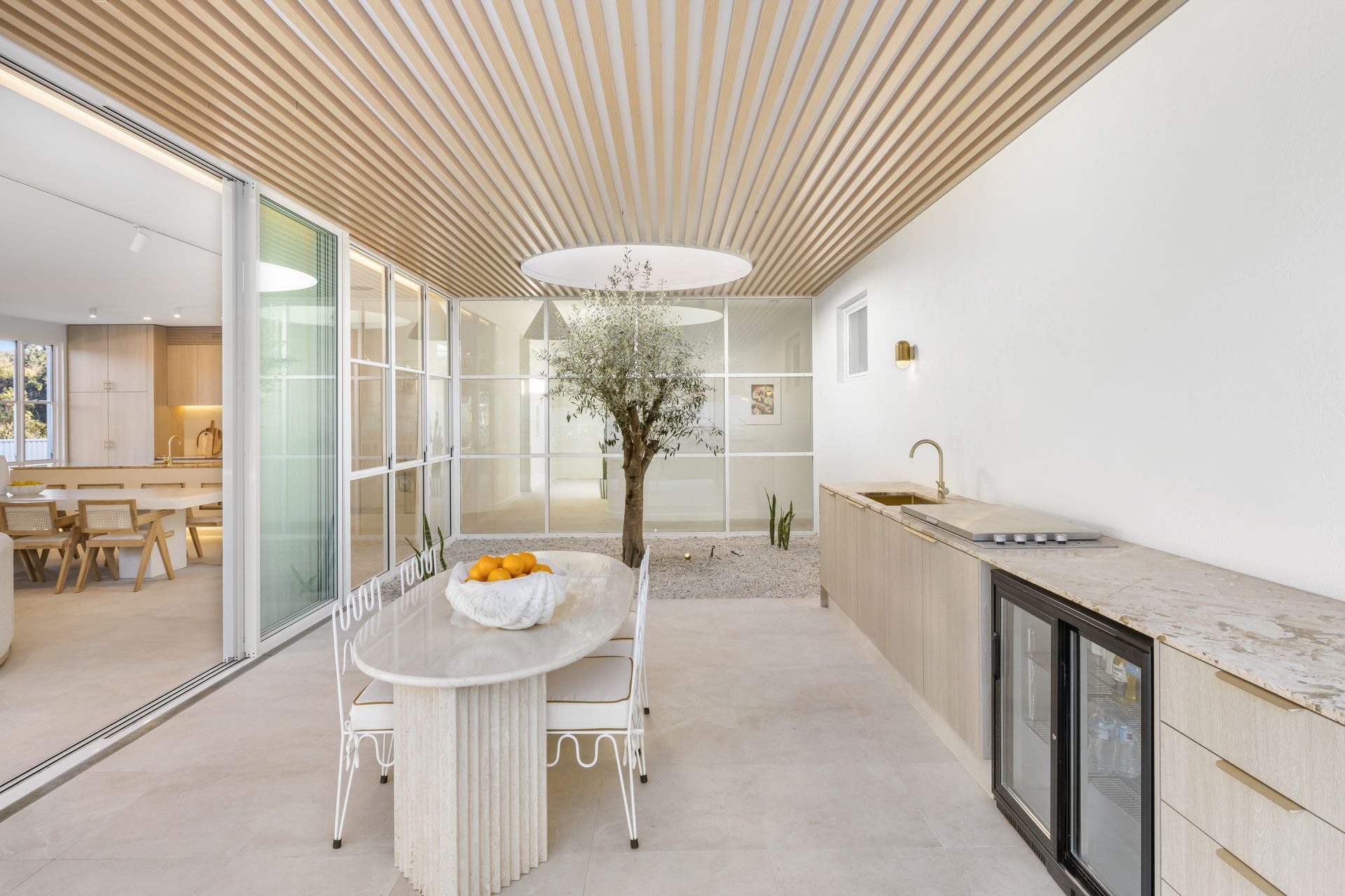 The Kellyville project by Map Architects brings light into the centre of the house through a courtyard with light well.