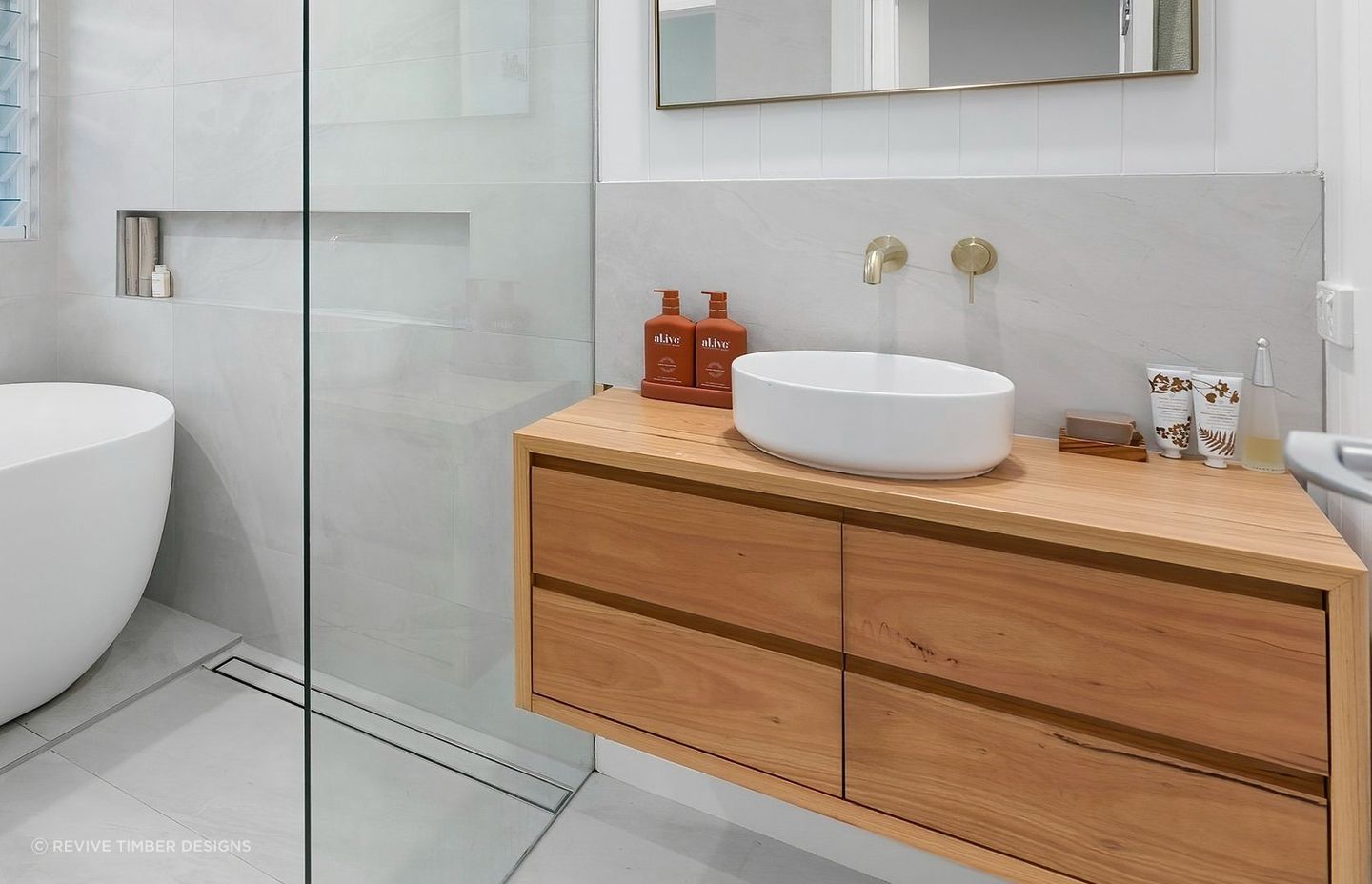 A wooden bathroom vanity can bring instant warmth into a space. Featured Product: Handcrafted Lily Vanity