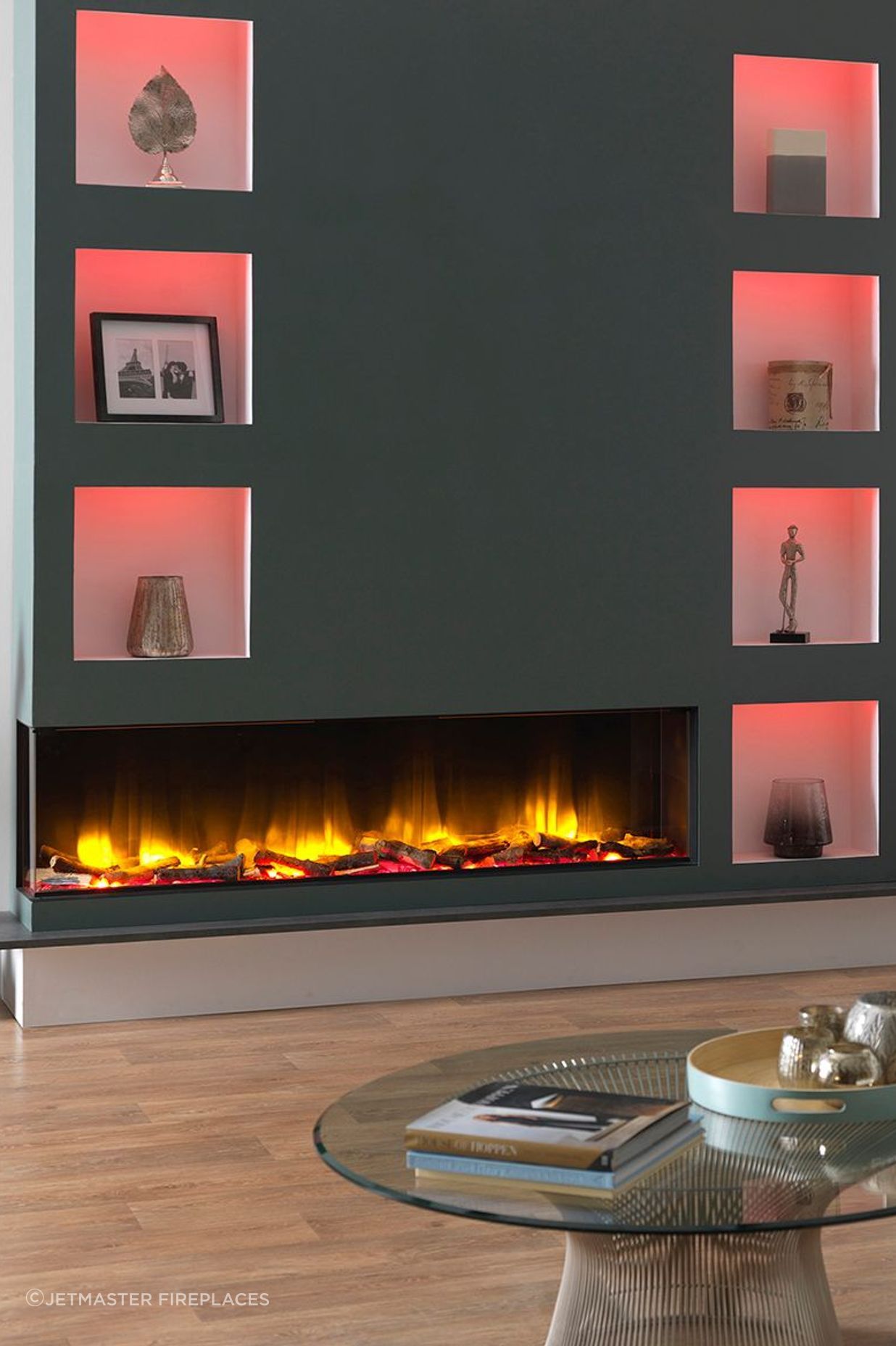 The 1600E Electric Fireplace complements the room's interior lighting with its own warm glow.