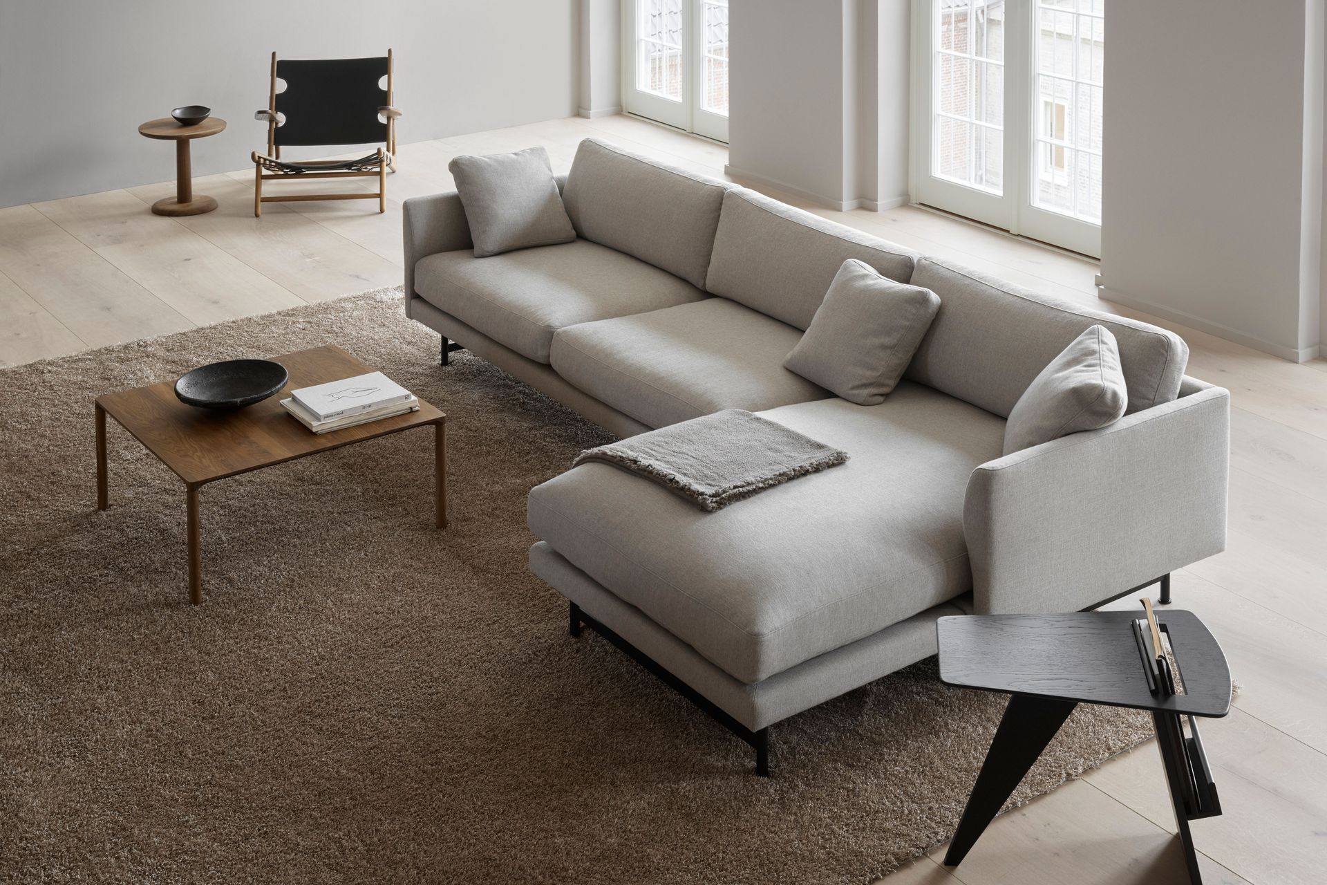 Chaise lounges are a good seating option to consider for large open spaces. Featured product: Calmo 3-Seater Chaise 95 Metal Fredericia.