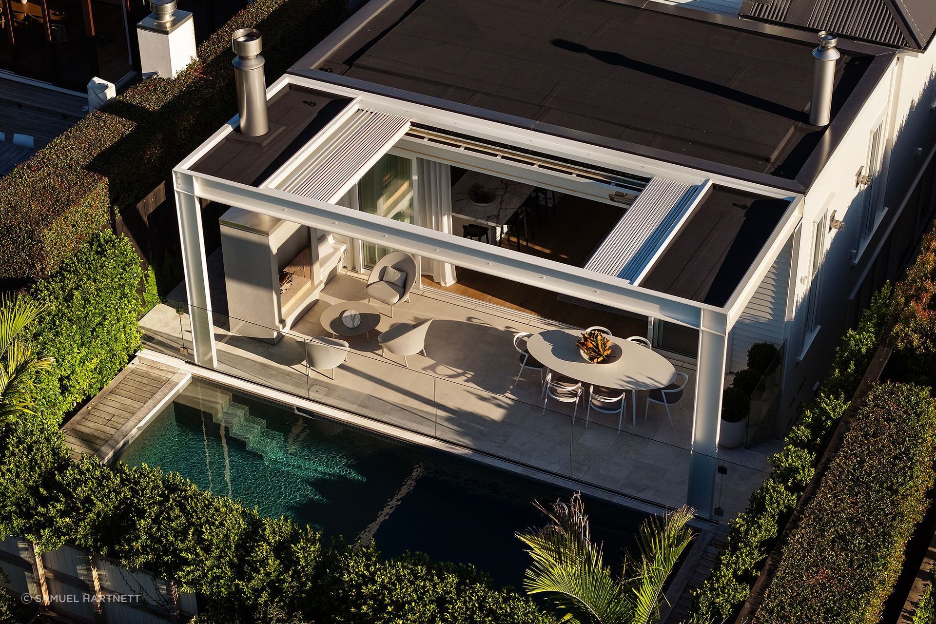 The site of teh Grey Lynn villa was dug out to form a basement level for garaging, wine cellar, office, and media room, and a pool was added at the rear.