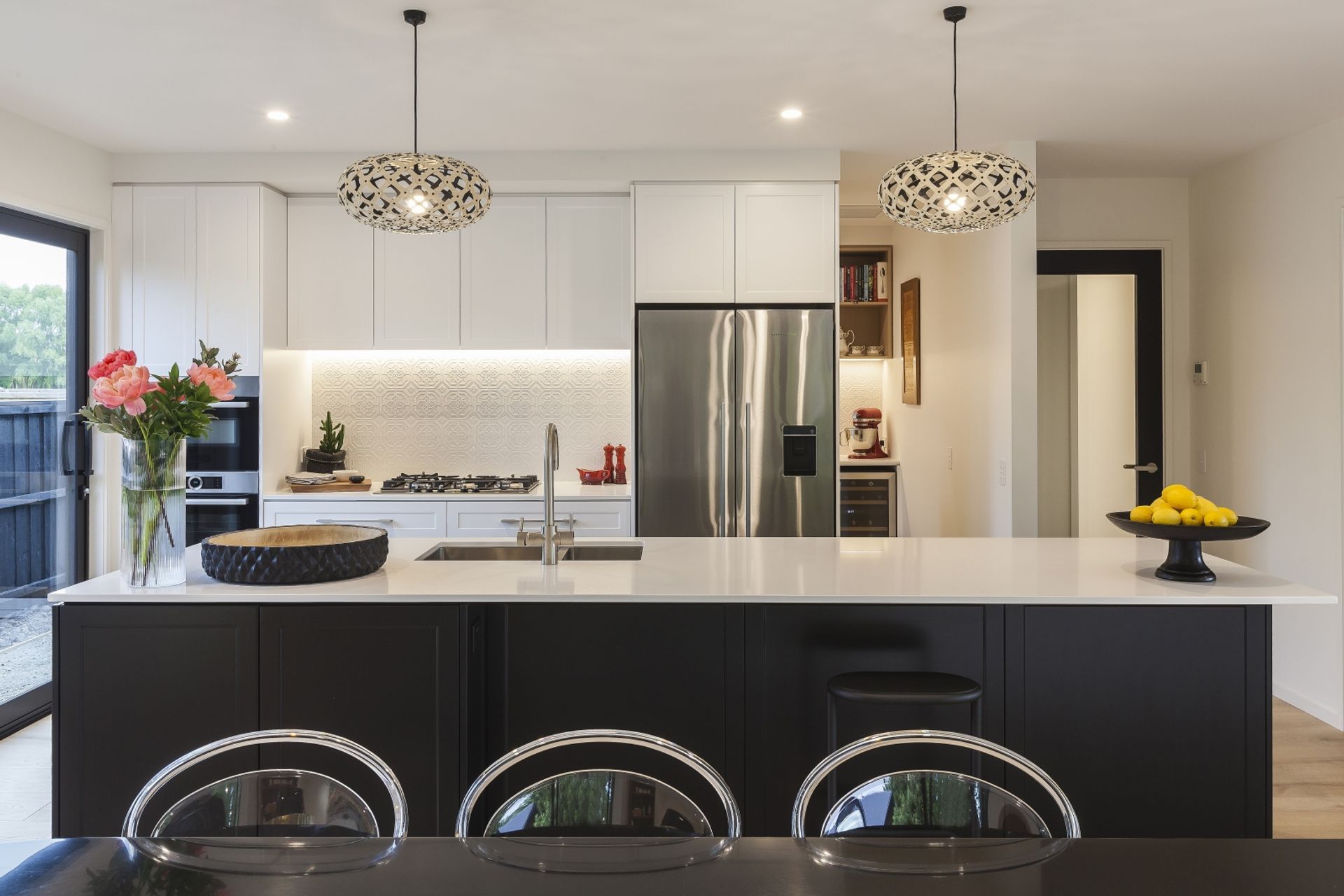 The kitchen in this Tai Tapu home is a chic blend of town and country aesthetics.