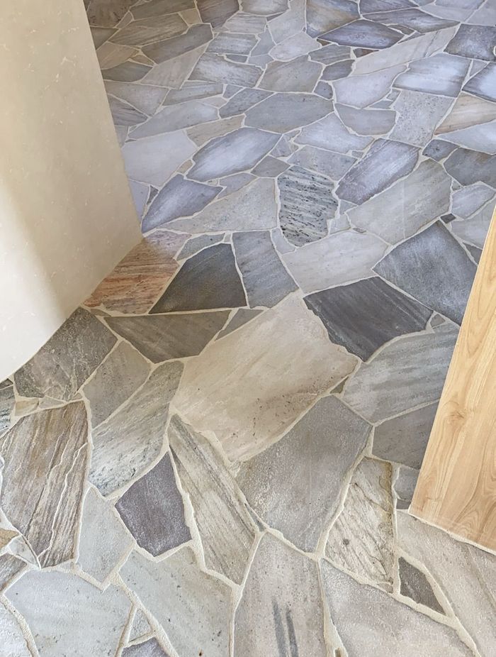 Complicated organic stone tiles need an experienced tiler to lay them.