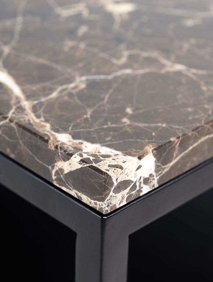 Marble is a common coffee table surface and showcases natural veining patterns.