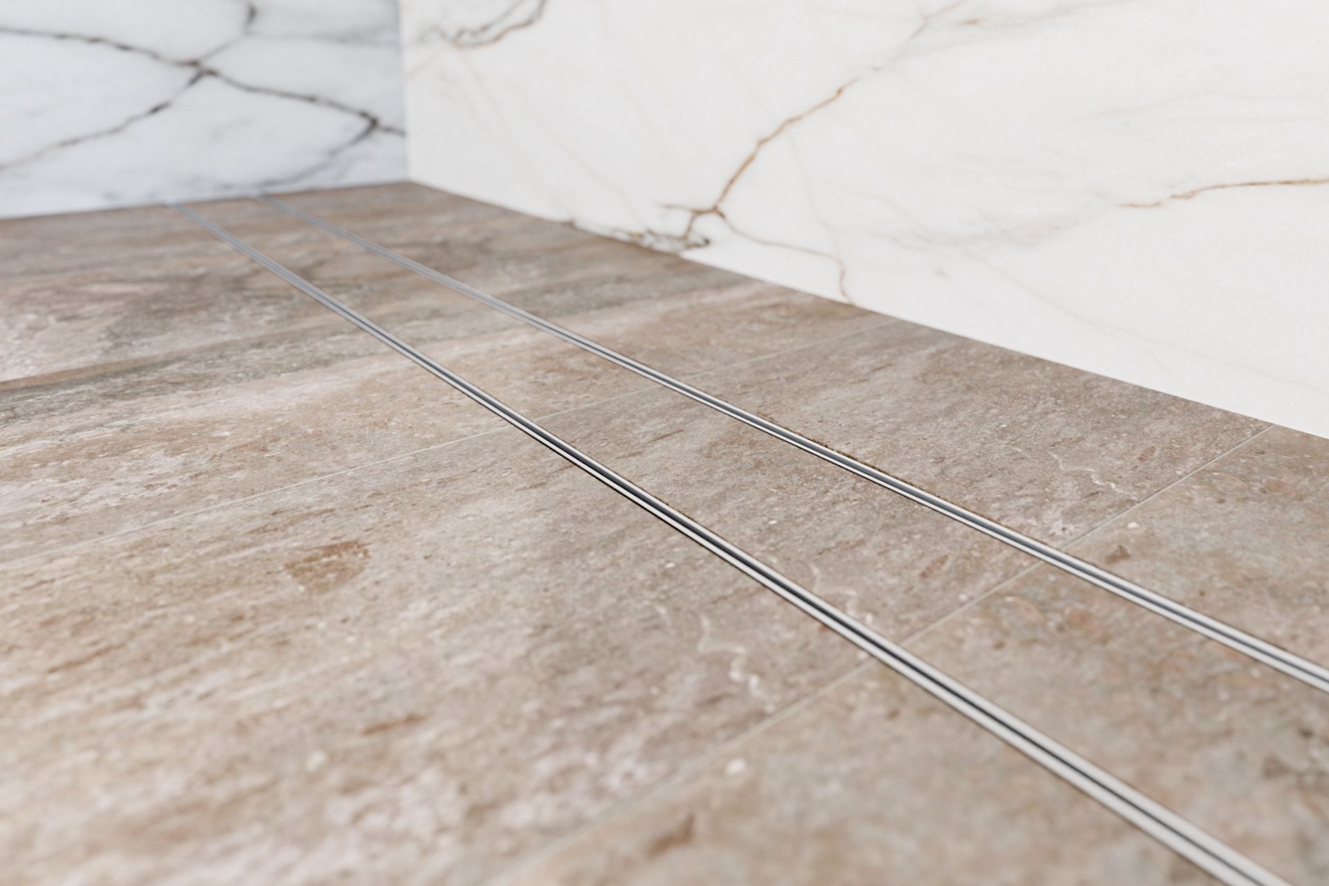 This slimline linear drain from Stormtech allows you to seamlessly lay tiles, flush with the wetroom floor.
