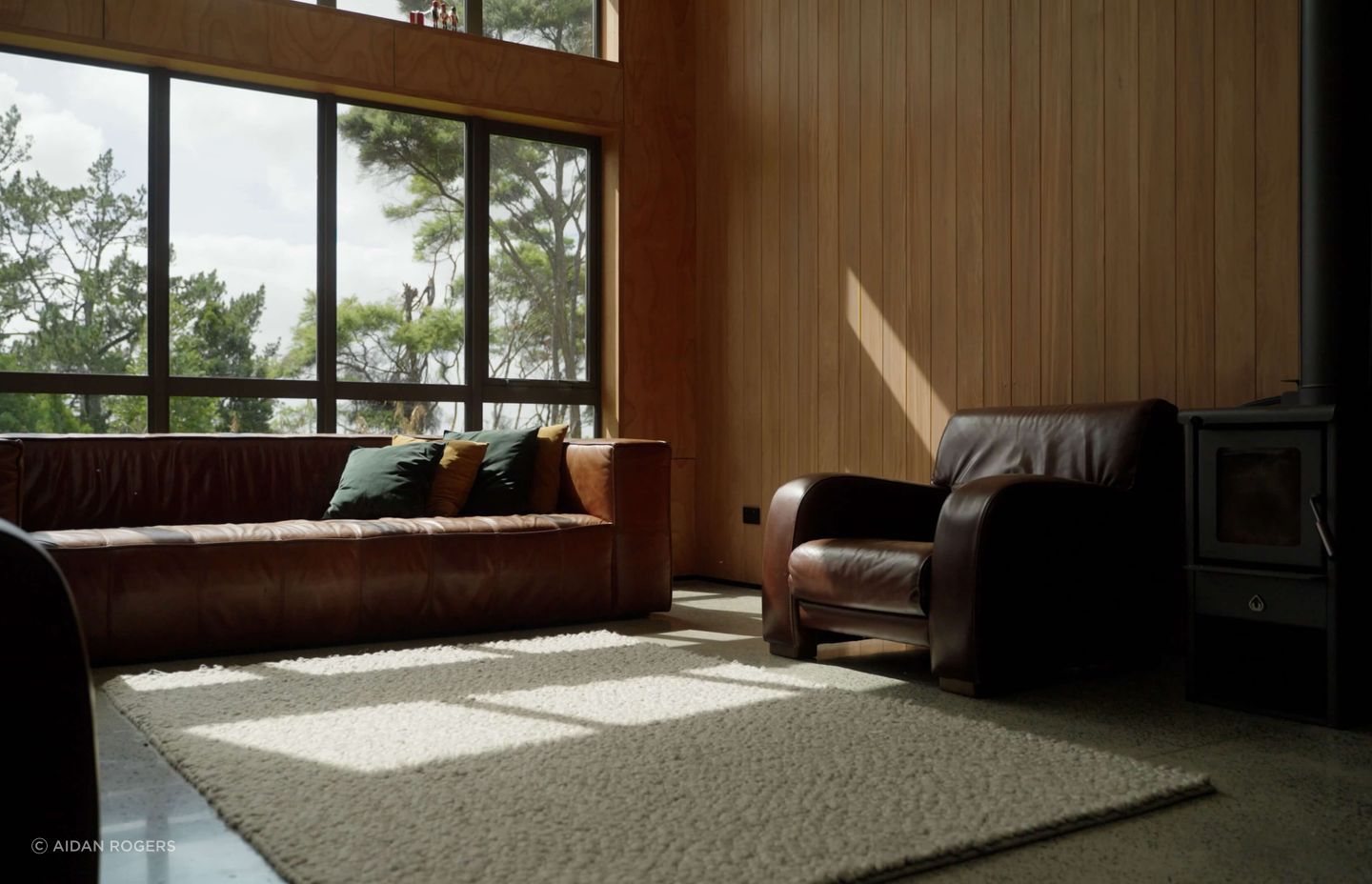 Cedar-lined walls, a freestanding fireplace and double-glazing give this lounge a cosy new vibe.