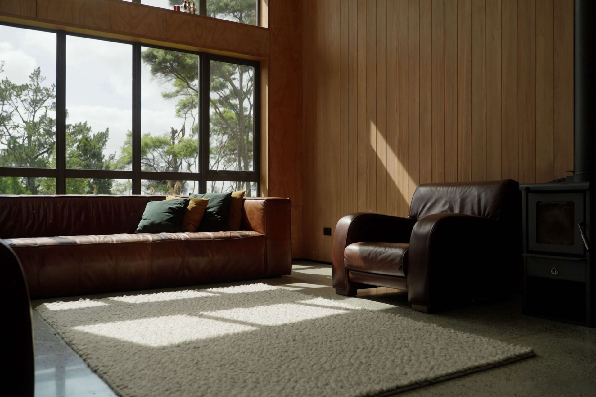 Cedar-lined walls, a freestanding fireplace and double-glazing give this lounge a cosy new vibe.