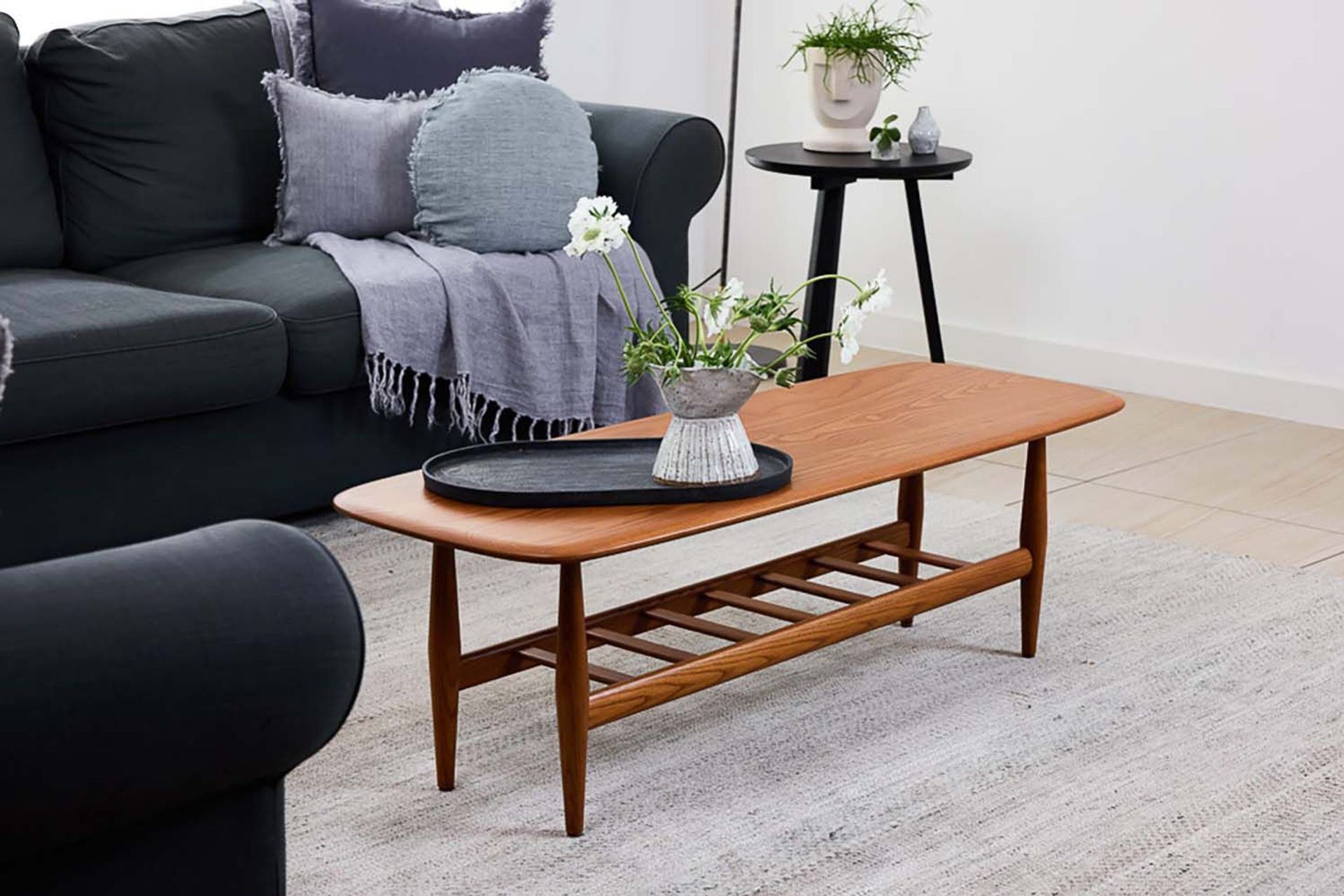 This solid dark ash coffee table boasts a convenient, functional magazine rack. Featured product: Frisco Coffee Table.