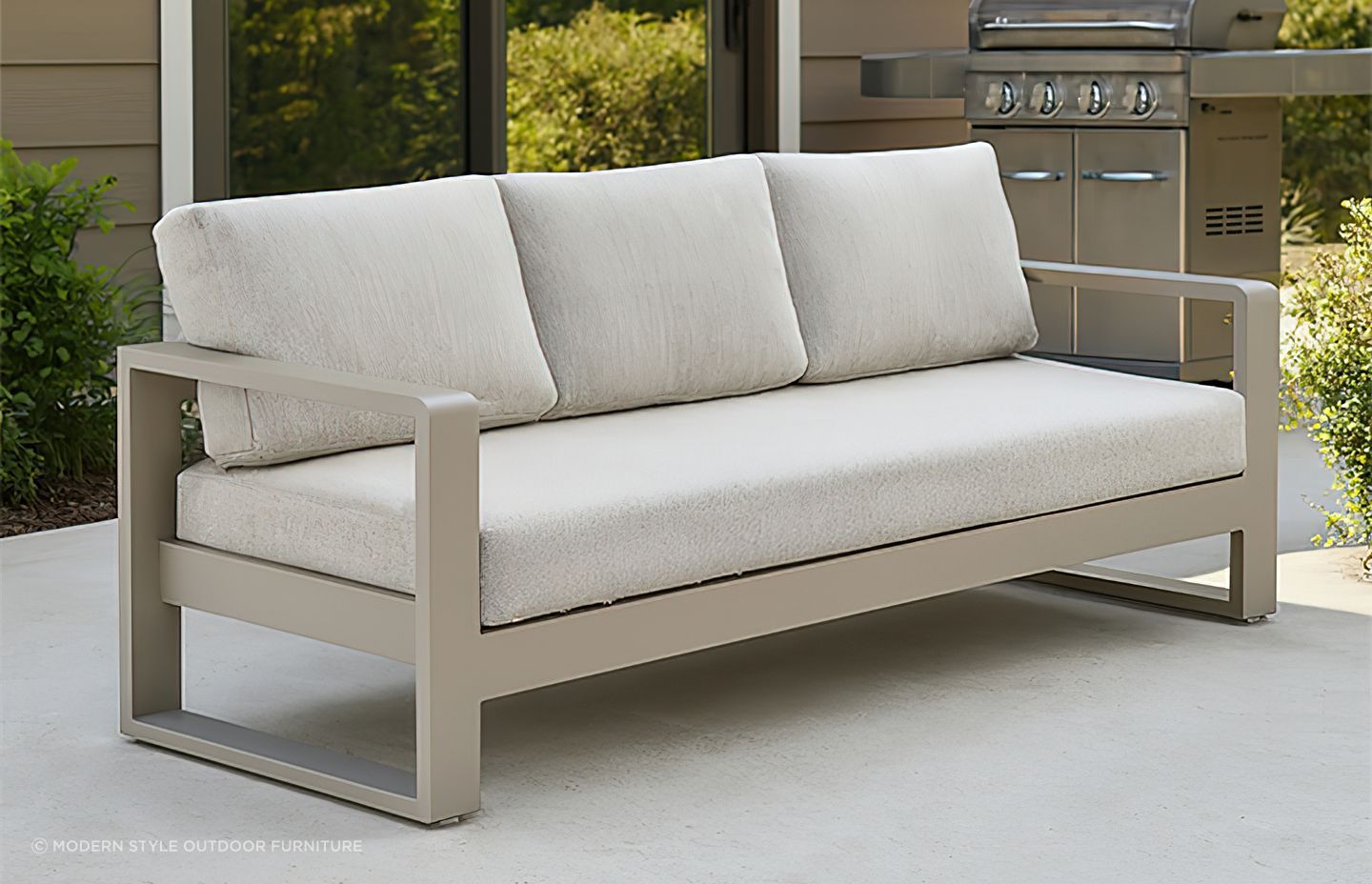 A-modern-outdoor-sofa-with-a-sleek-beige-metal-frame-and-thick-light-grey-cushions-2.jpg