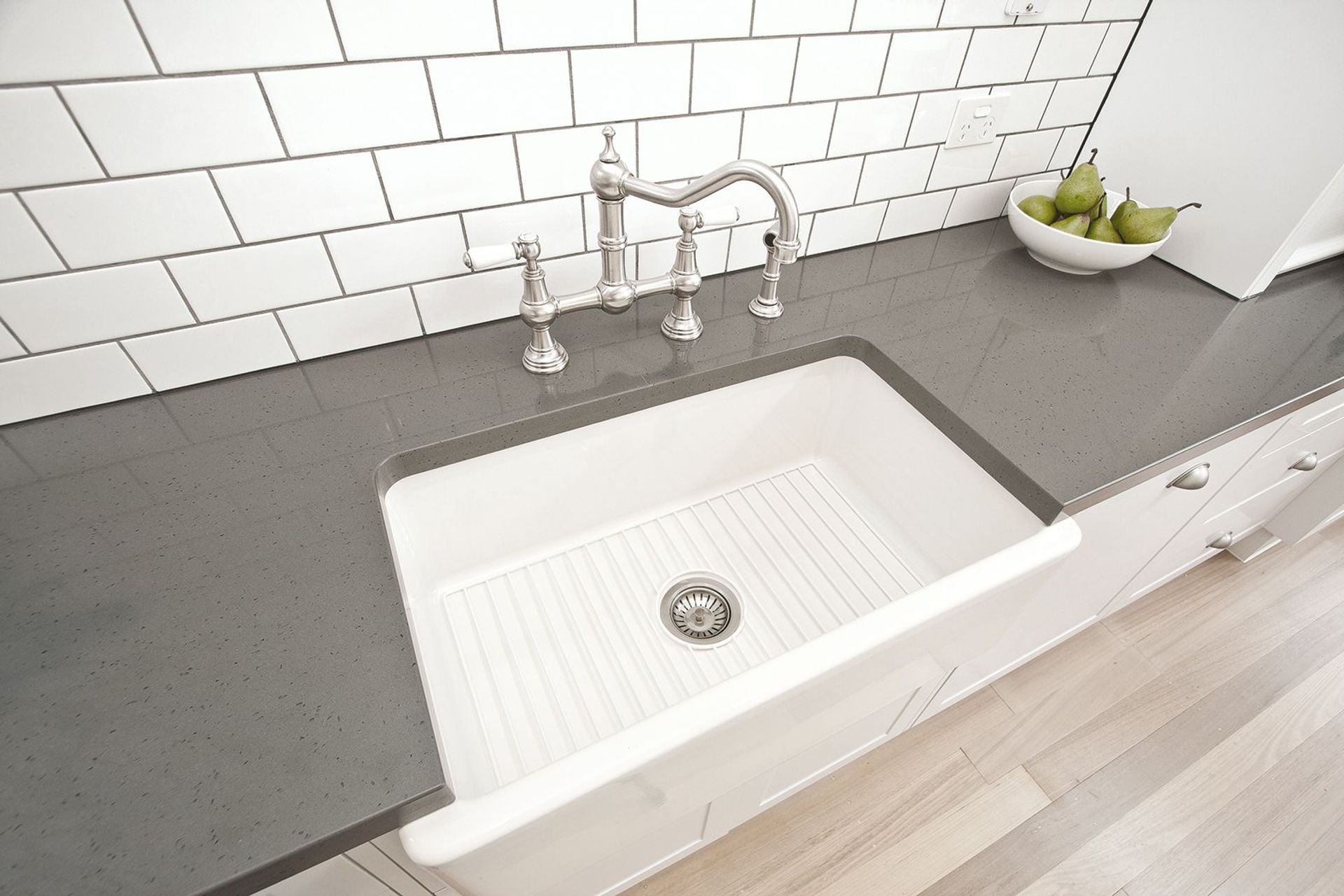 Timeless and robust — the Acquello Fireclay Sink with Waste and Rack from The English Tapware Company.