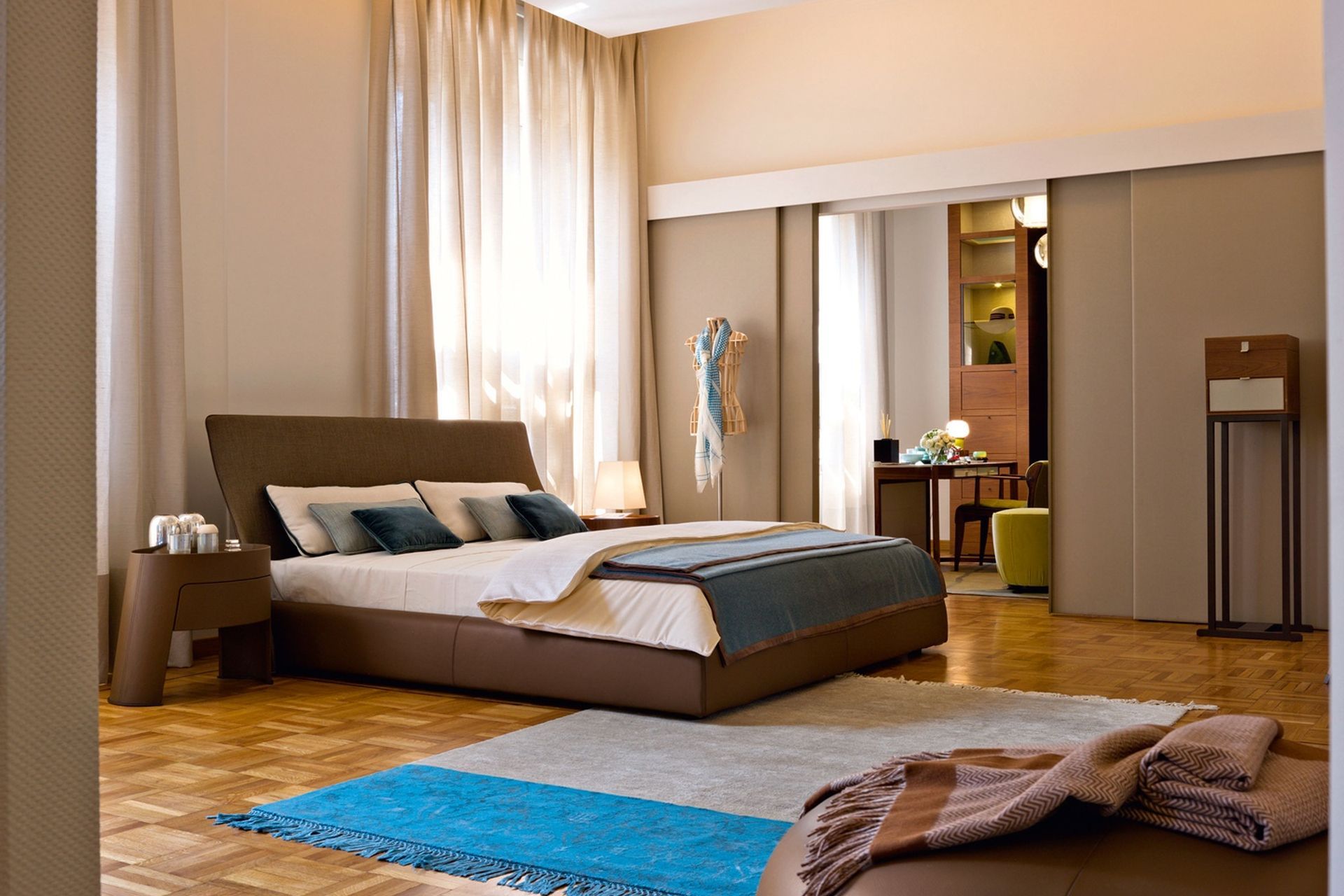 Your walls don't have to be completely white to create a brighter look in your bedroom, as shown here in this stylish space featuring the Altea Bed by Georgetti.