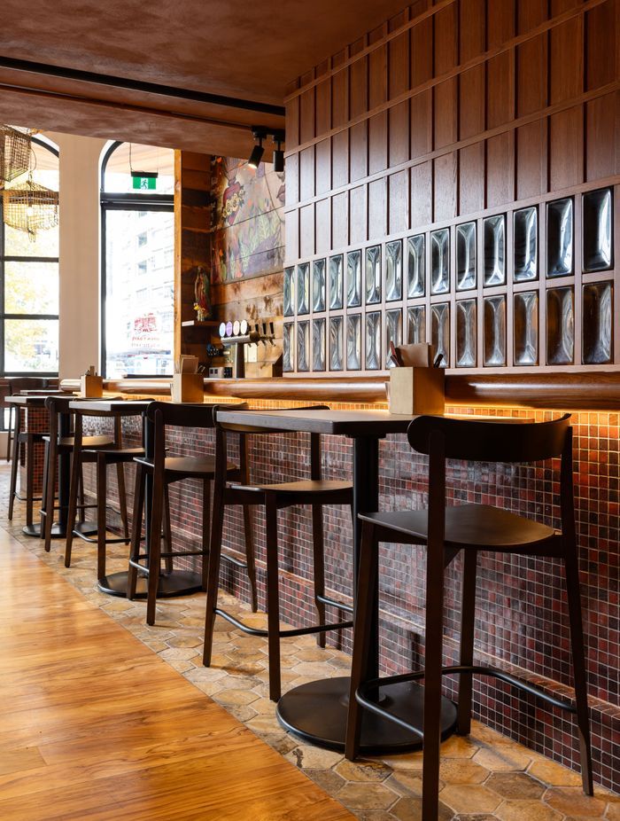 Clever under-counter lighting creates warmth and illumination in this hospitality fit-out by Dimension Shopfitters.