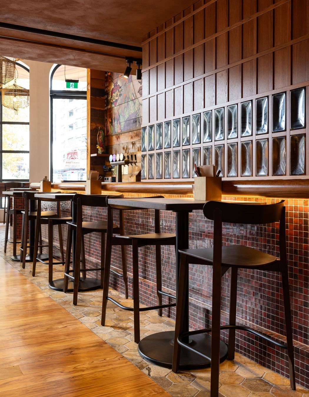 Clever under-counter lighting creates warmth and illumination in this hospitality fit-out by Dimension Shopfitters.