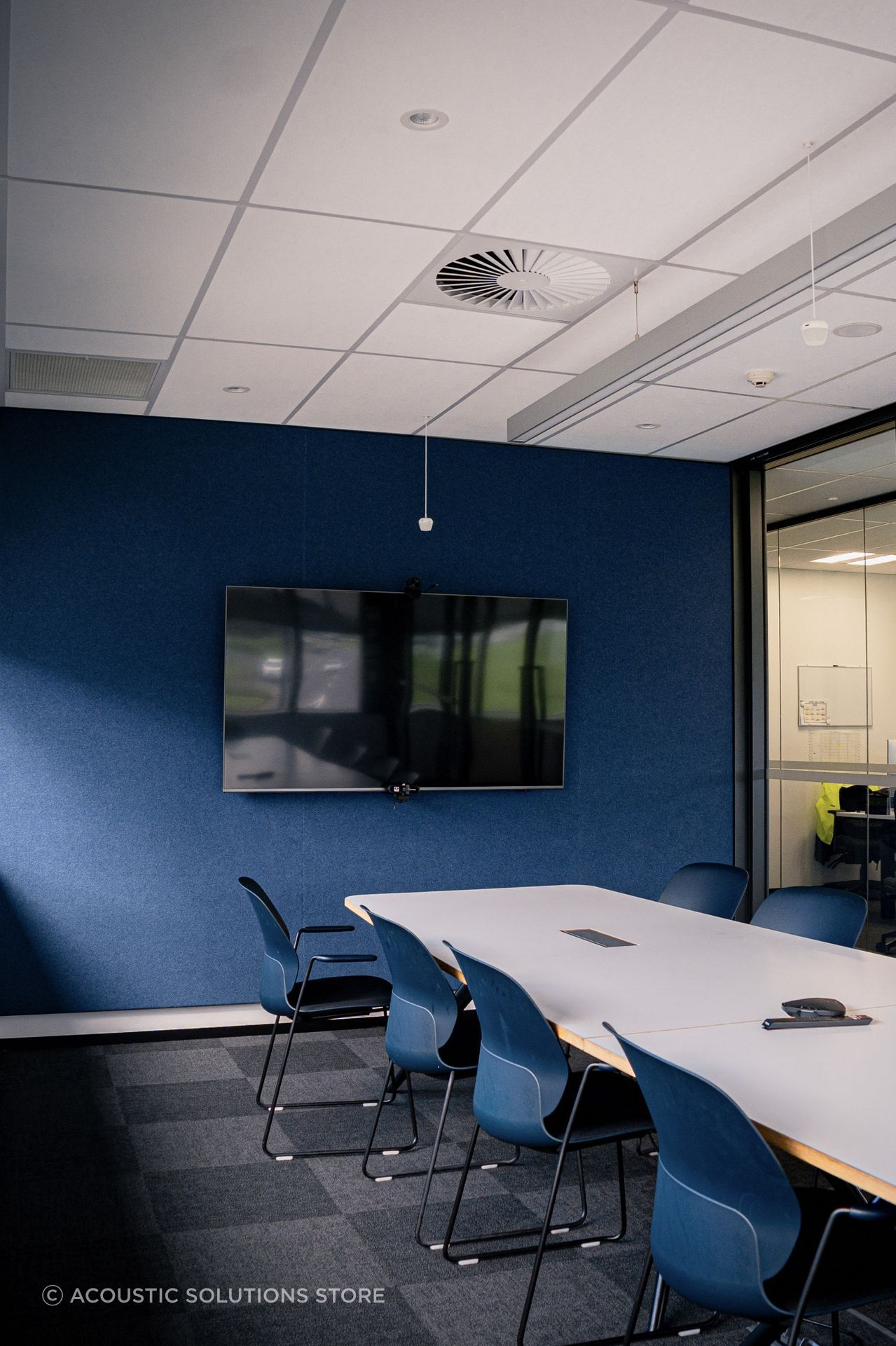 For the meeting rooms and wall elevations, Acoustic Solutions Store installed full-height 2800mm Quietspace panels in Nude White with Vertiface Muralla overlay finished with powder-coated aluminium trim in Flax Pod for a clean, architectural edge.