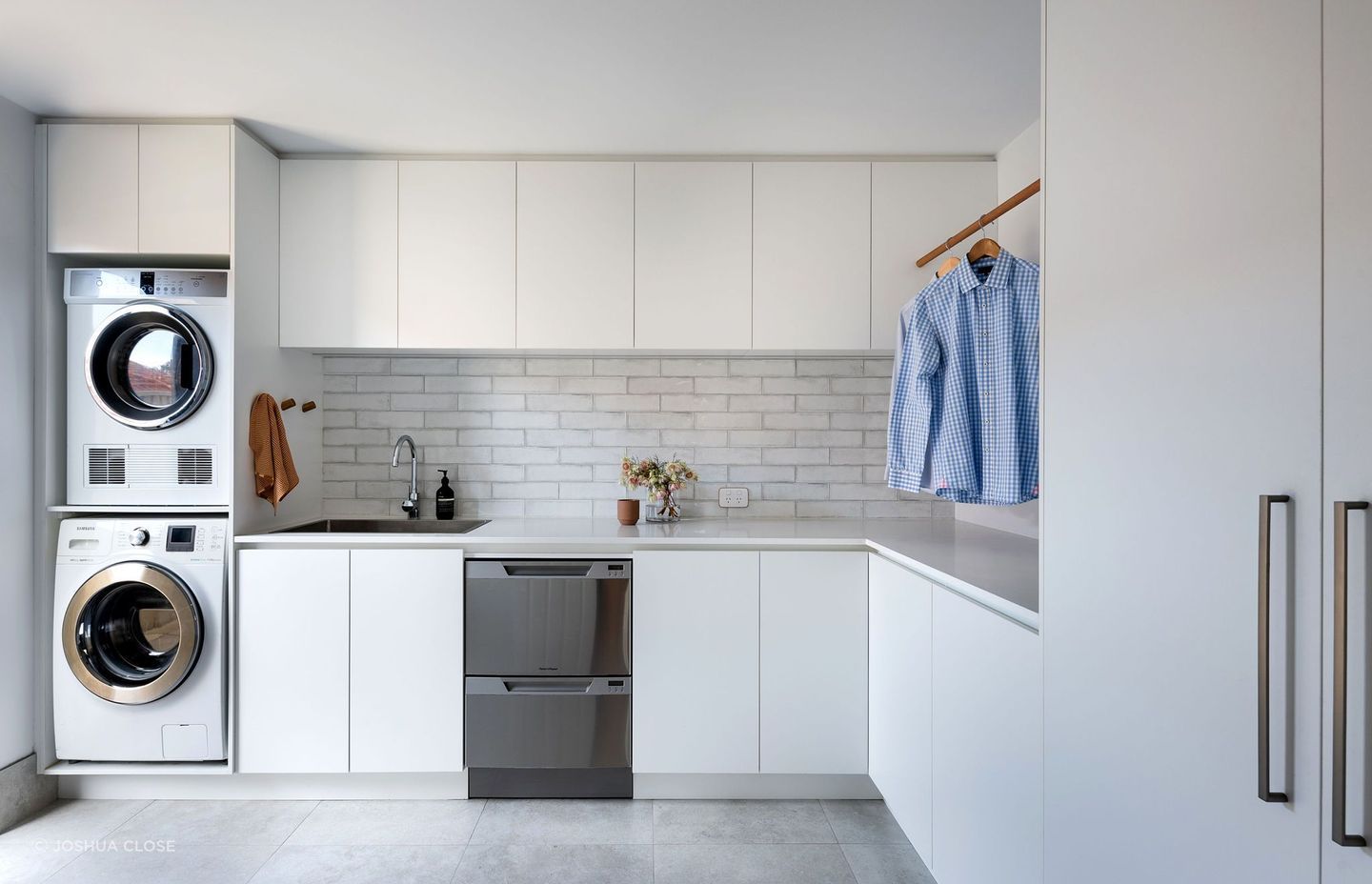 Front loaders are both water and energy efficient making them a popular choice for the family home, as seen in this stylish space by Adela Design. | Photography: Joshua Close