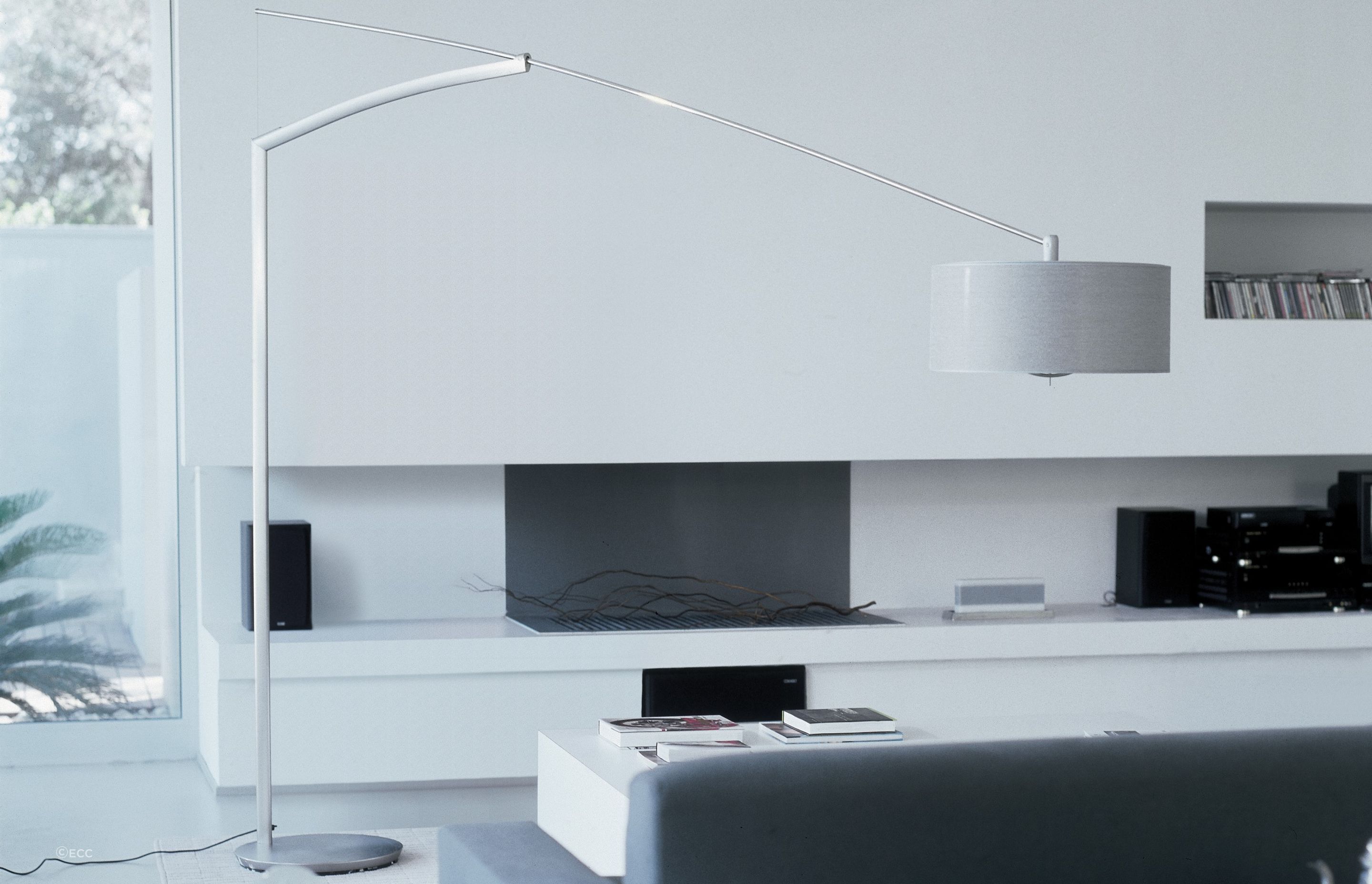 A stunning floor lamp like the Balance Floor Lamp by Jordi Viladrell for Vibia can bring a room together.