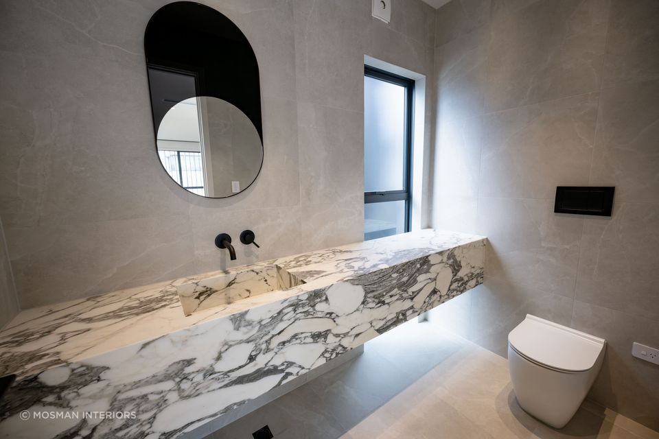 A stunning wall hung vanity by Mosman Interiors featuring exquisite Calacatta Marble.