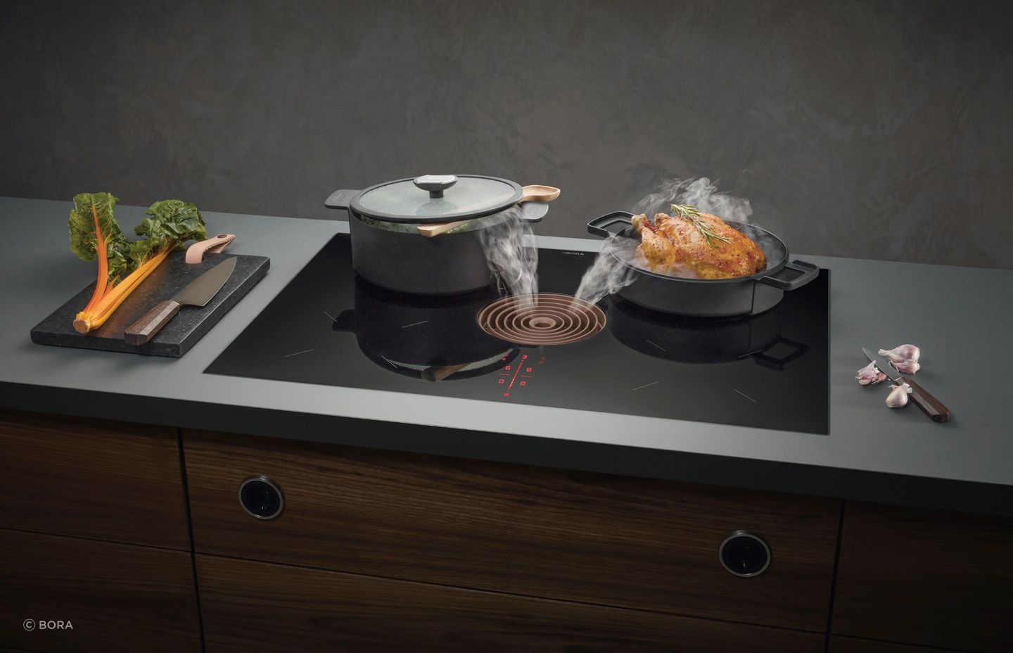The Bora Pure Combined Cooktop and Extractor is a modern and elegant solution that sits flush against a benchtop.