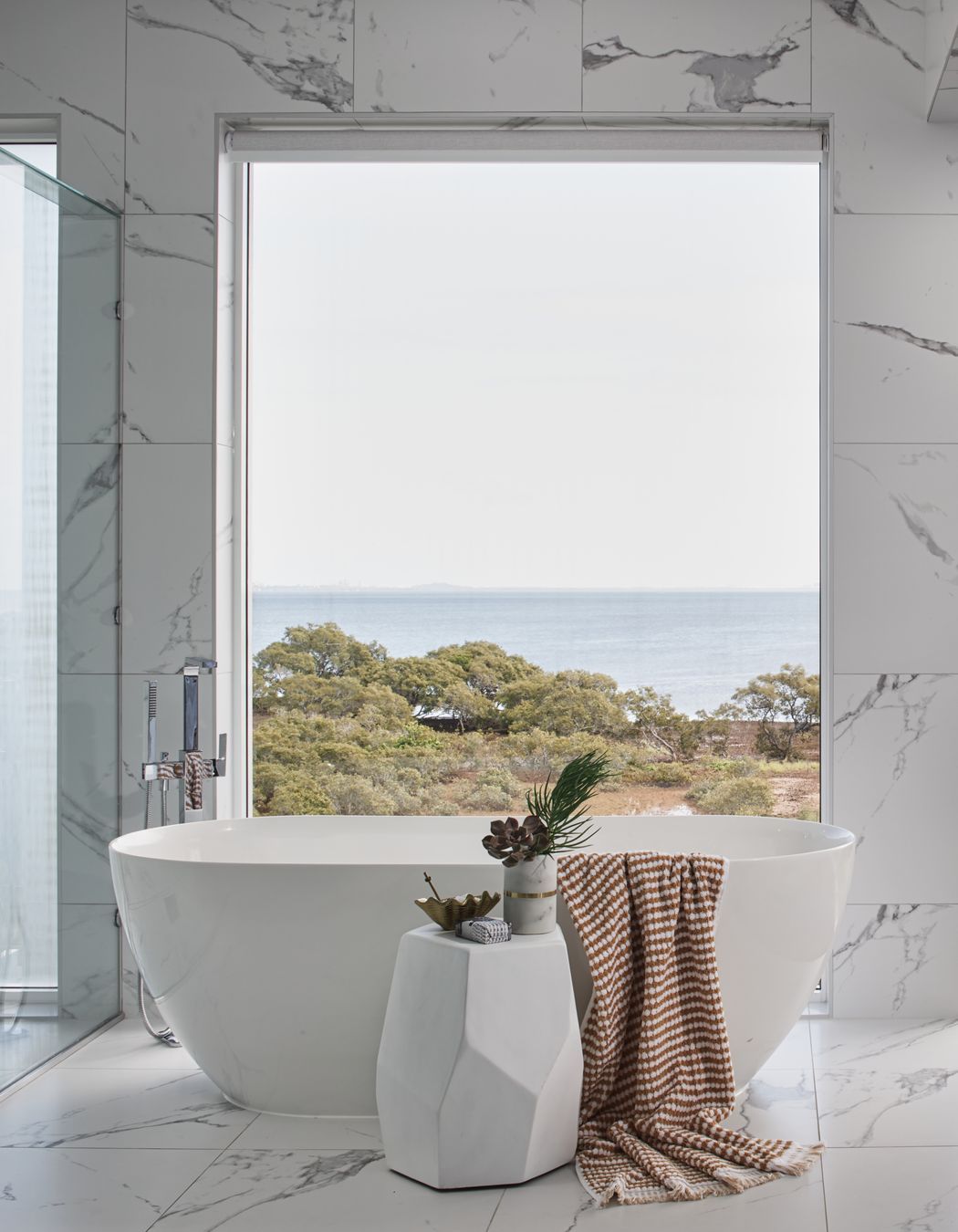 The perfect view for a coastal style bathroom.