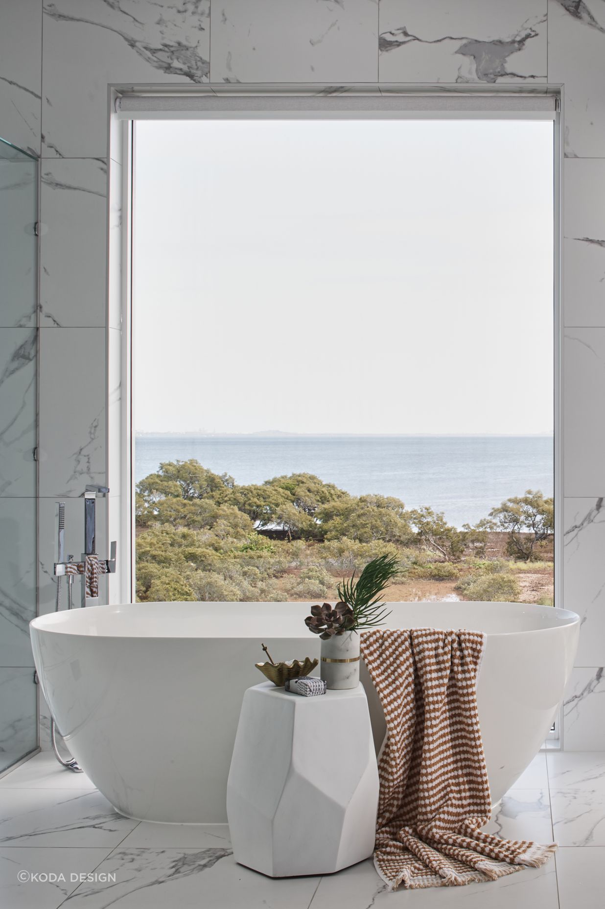 The perfect view for a coastal style bathroom.