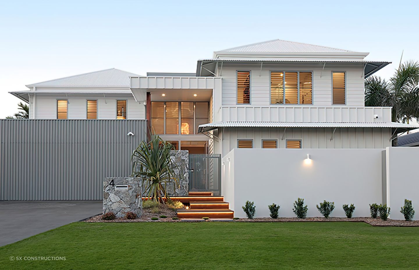 A hipped roof, known for its slopes on all four sides that meet at the top, offering durability and stability against high winds and extreme weather. Featured project: Bokarina Beach.