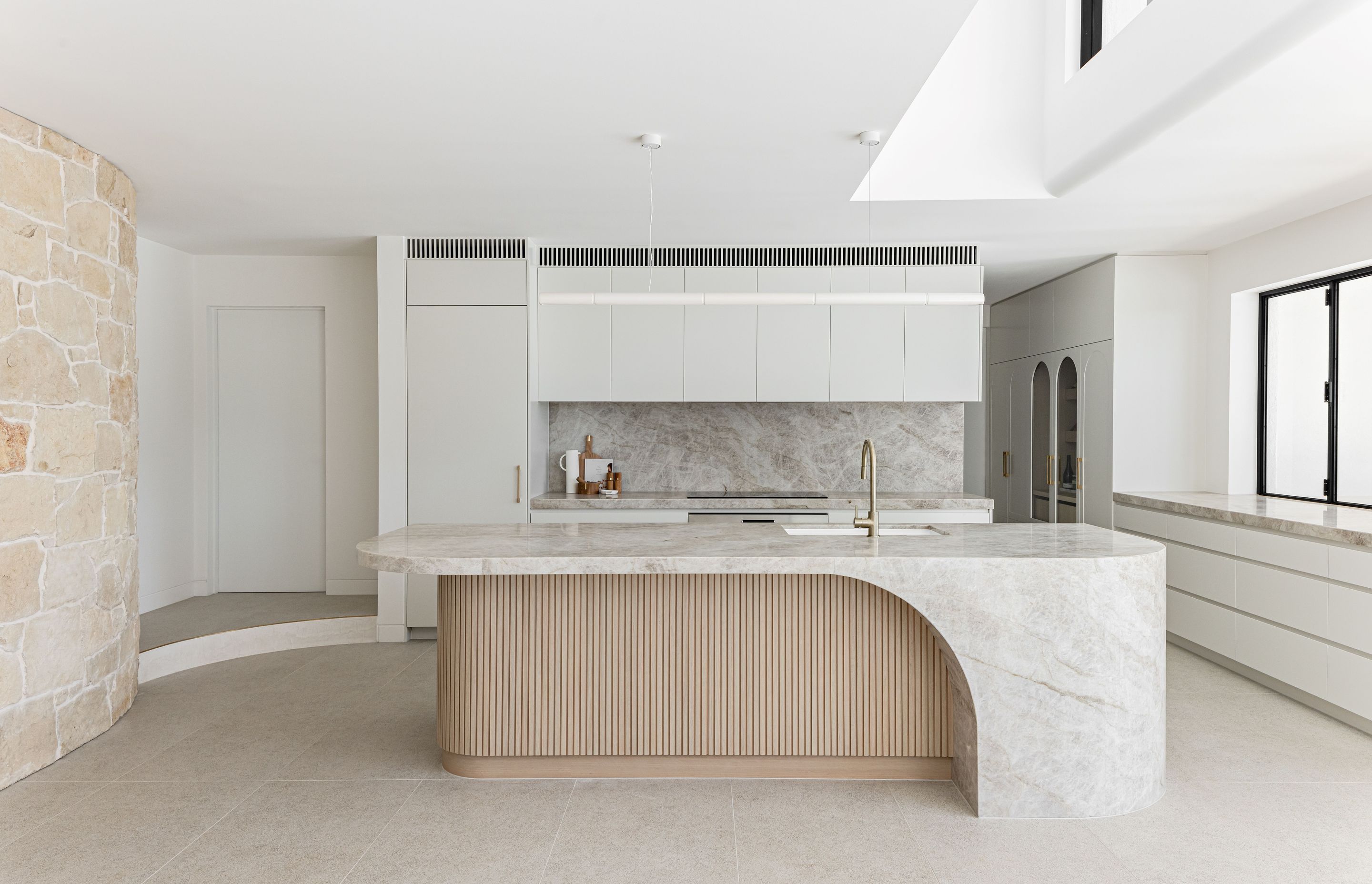 This kitchen by MattBuild Group celebrates multiple materials and attention to detail to create a cohesive, serene space.
