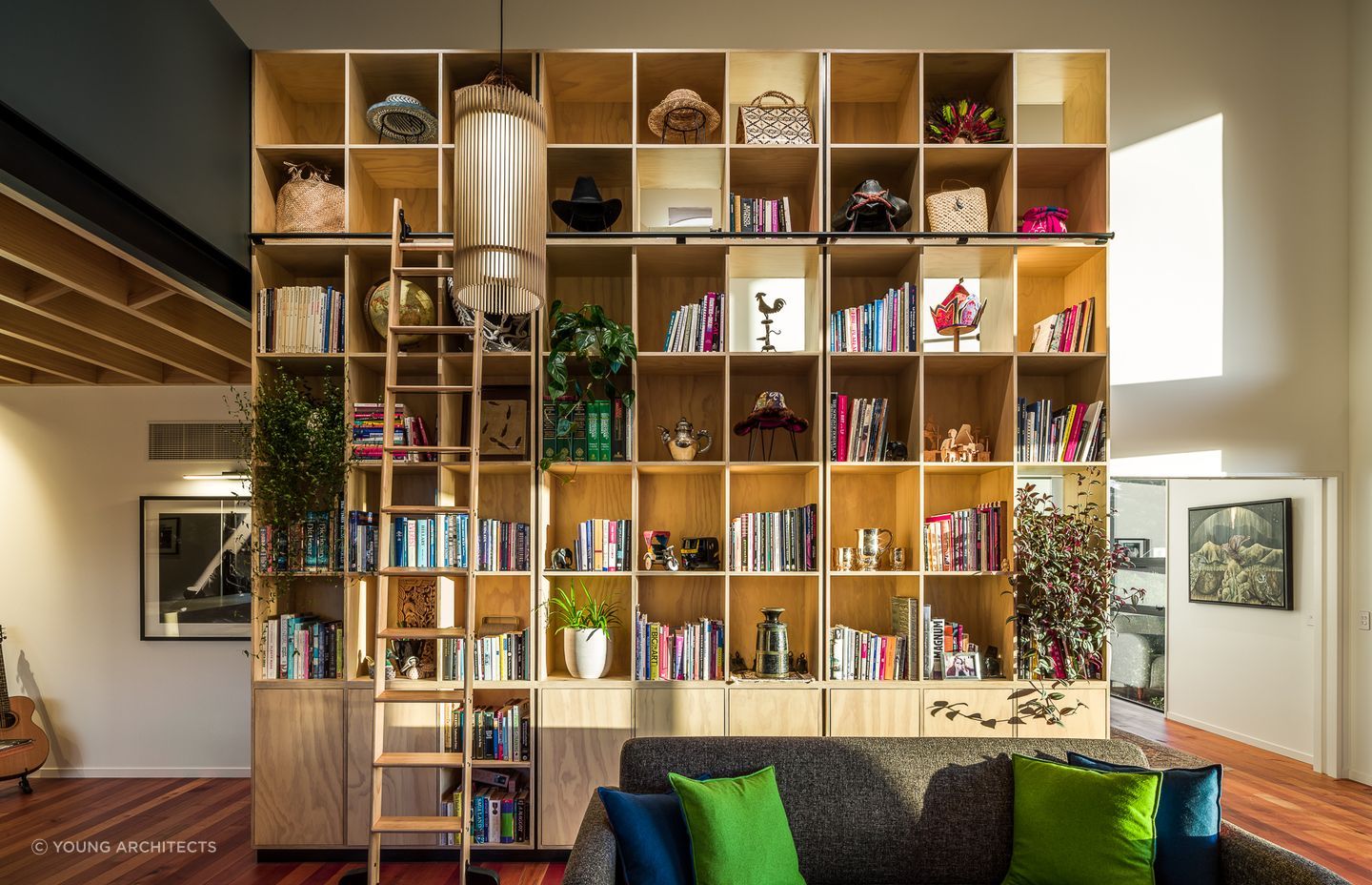 The inclusion of some beautiful pot plants brings tremendous vitality to this impressive bookcase in this home in the Port Hills of Christchurch. Photography: Dennis Rademacher