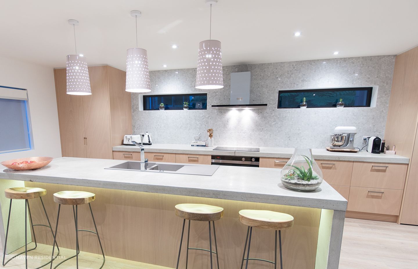 Mesmerising shades of grey on the kitchen wall of the inspiring Castor Bay Stream House.