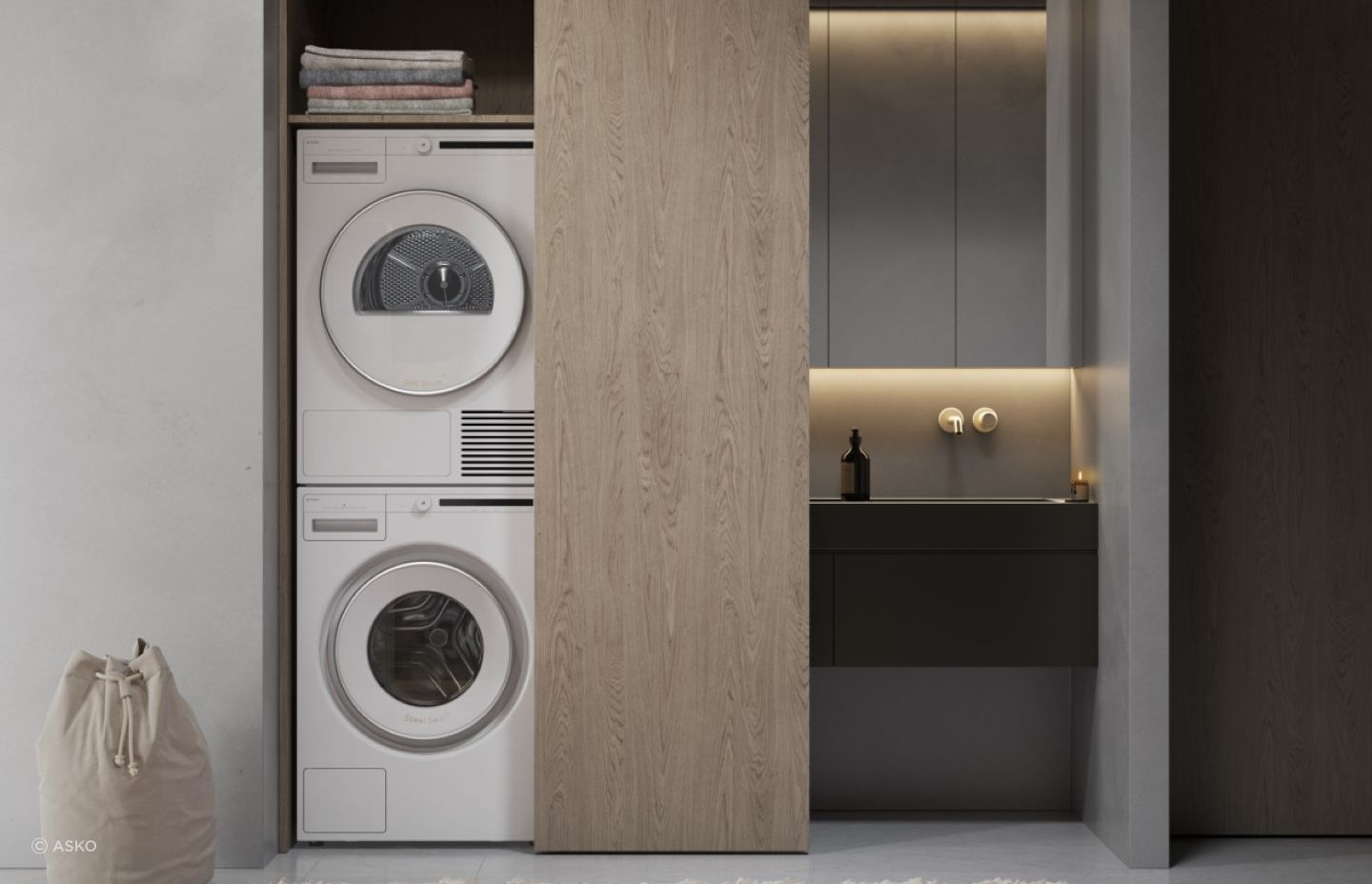 The Classic 8kg Dryer by ASKO, stacked here above a washing machine, is a fine example of a modern condenser dryer.