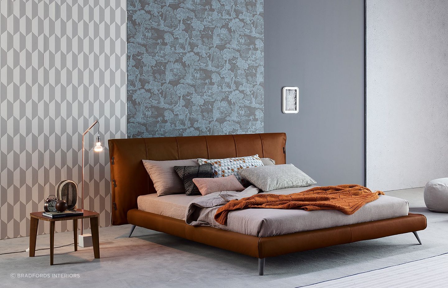 Bedroom furniture with legs allow more light to pass through to preserve the brightness in a space, seen here with the exquisite Cuff Bed by Bonaldo.