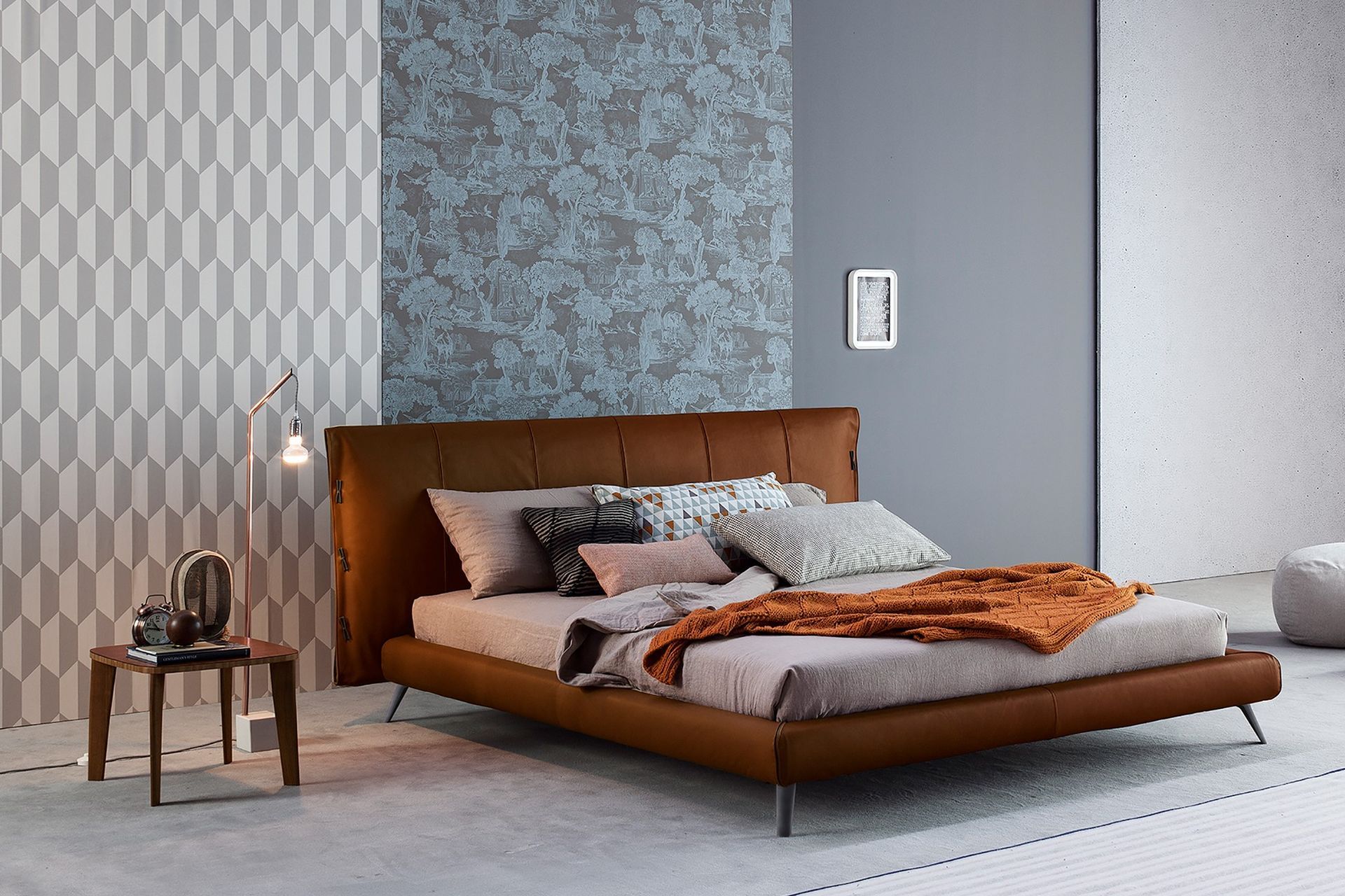 Bedroom furniture with legs allow more light to pass through to preserve the brightness in a space, seen here with the exquisite Cuff Bed by Bonaldo.