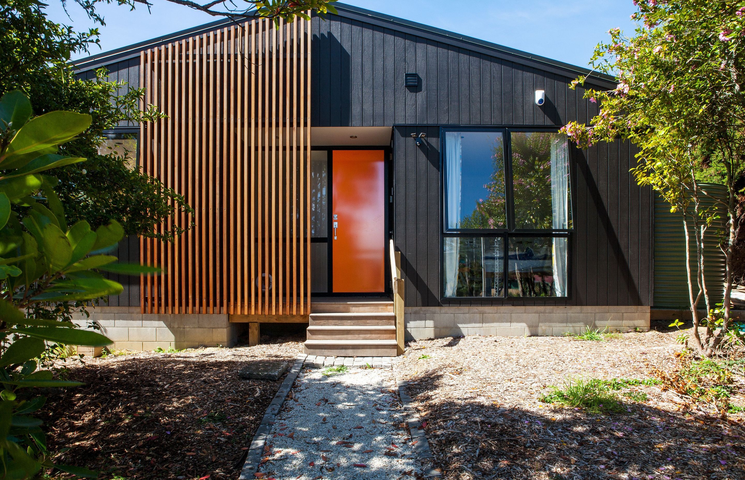 One of Artis Homes first designs. Elegantly symmetrical, the house contains a covered entry area, stepping into a spacious living area.