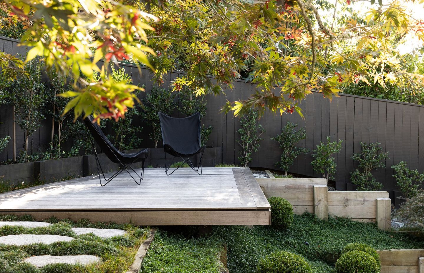 Hardscaping can be used to create sanctuaries of solitude, like this delightful space here in Crocus Place.